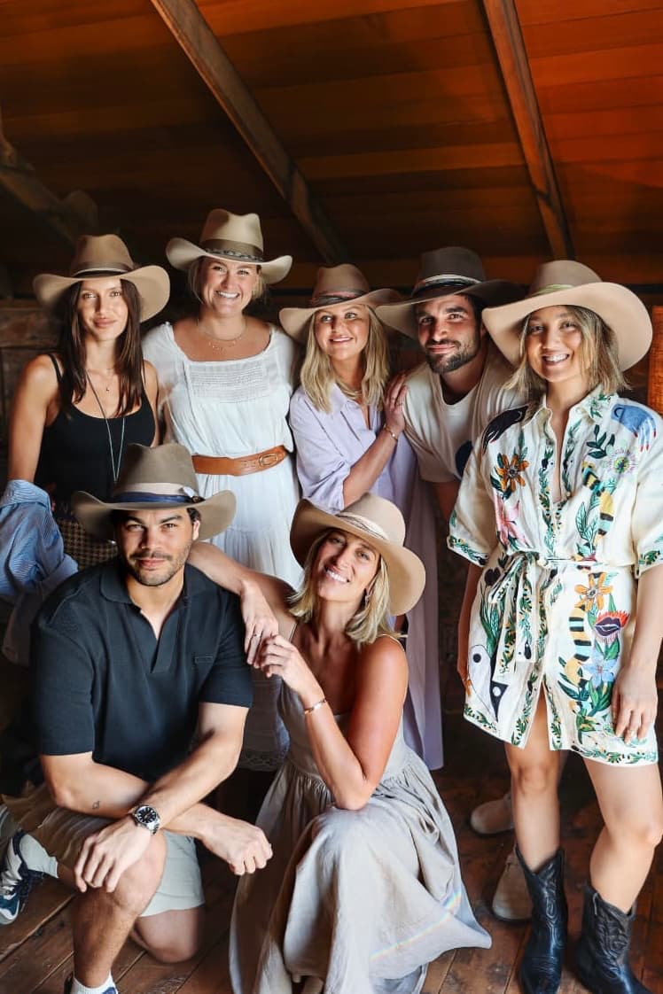 Group of guests wearing custom felt hats during a PHYLLi Group Hat Party experience in Australia.