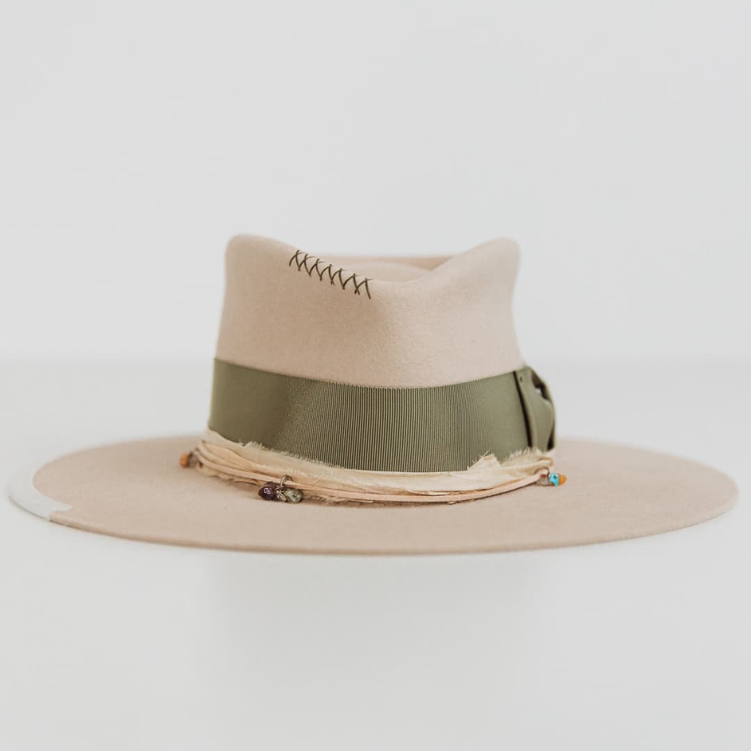 Front view of The Guardian beige felt hat by PHYLLi Designs with oil green grosgrain band and cream sari silk trim.