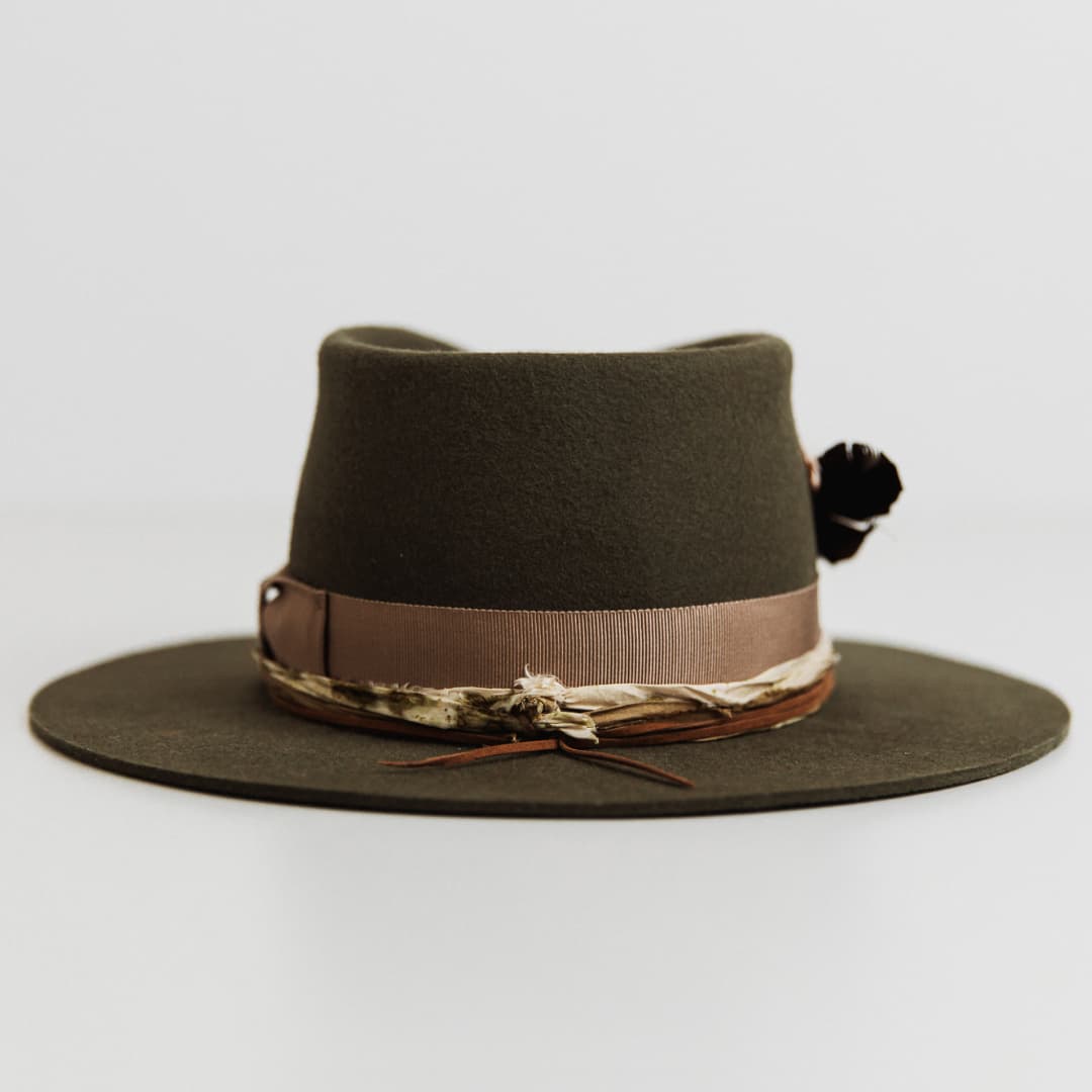Back view of The Lotus Military felt hat by PHYLLi Designs with sari silk trim and suede string.