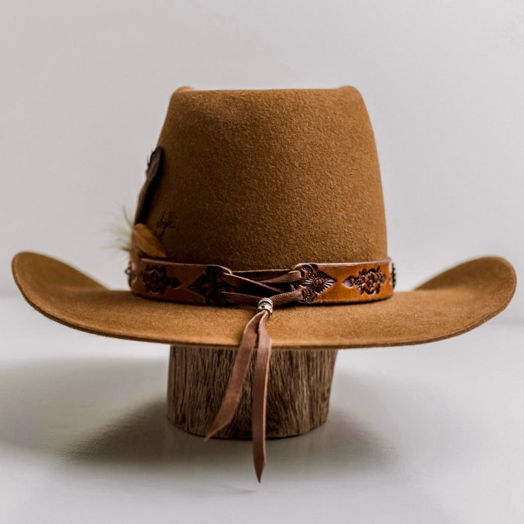 Back view of the Caramel cowboy hat The PHYLLi Caramel by PHYLLi Designs featuring burnt PHYLLi branded pattern on the back left.