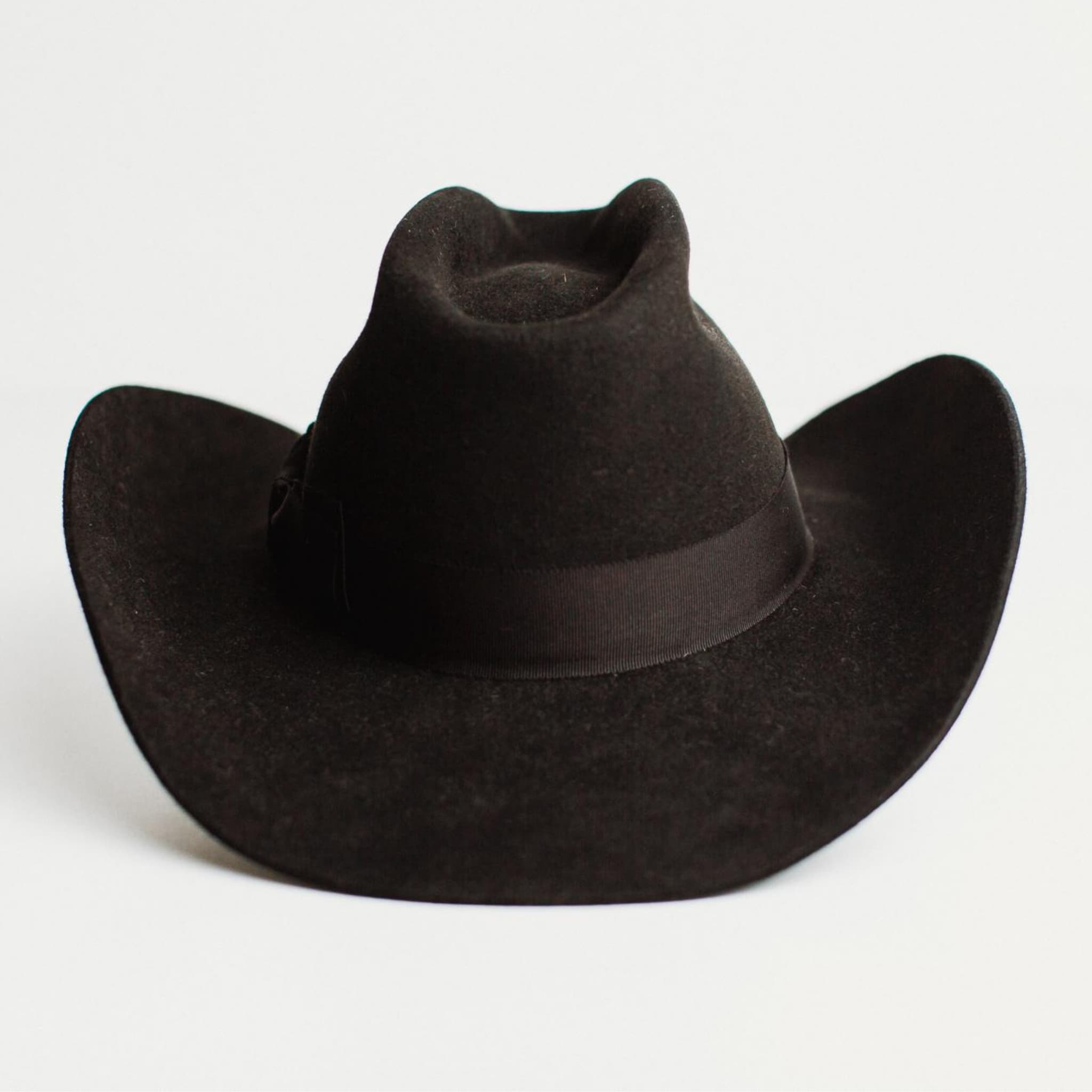 Back view of The Plains black cowboy hat by PHYLLi Designs in western weight rabbit felt with open road crown.
