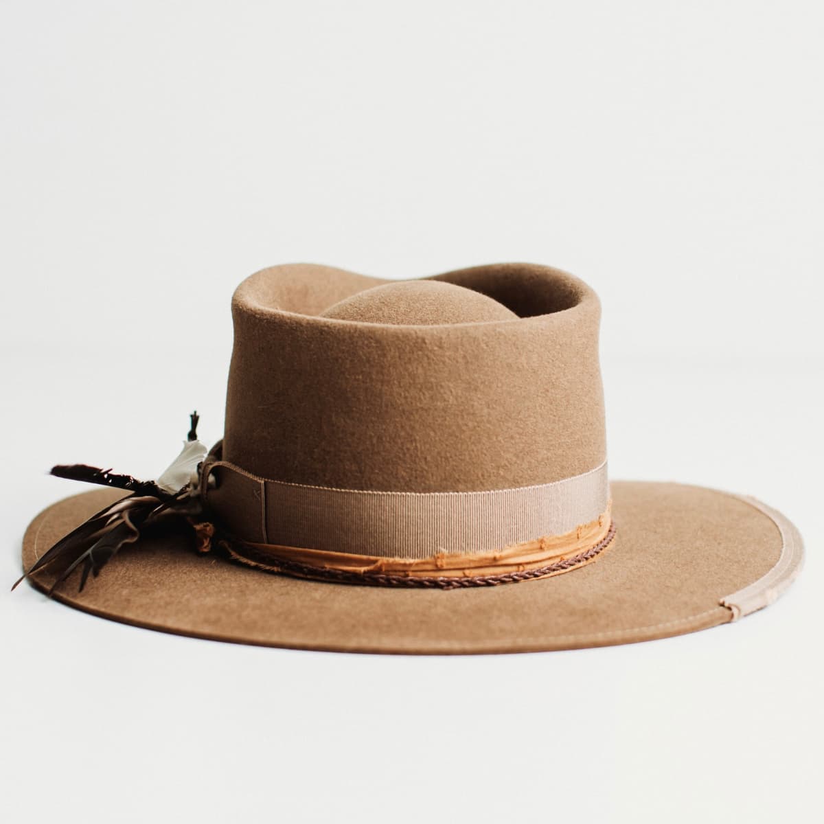 Back view of The Rider havana brown felt hat with vintage grosgrain bow band and feather detail.