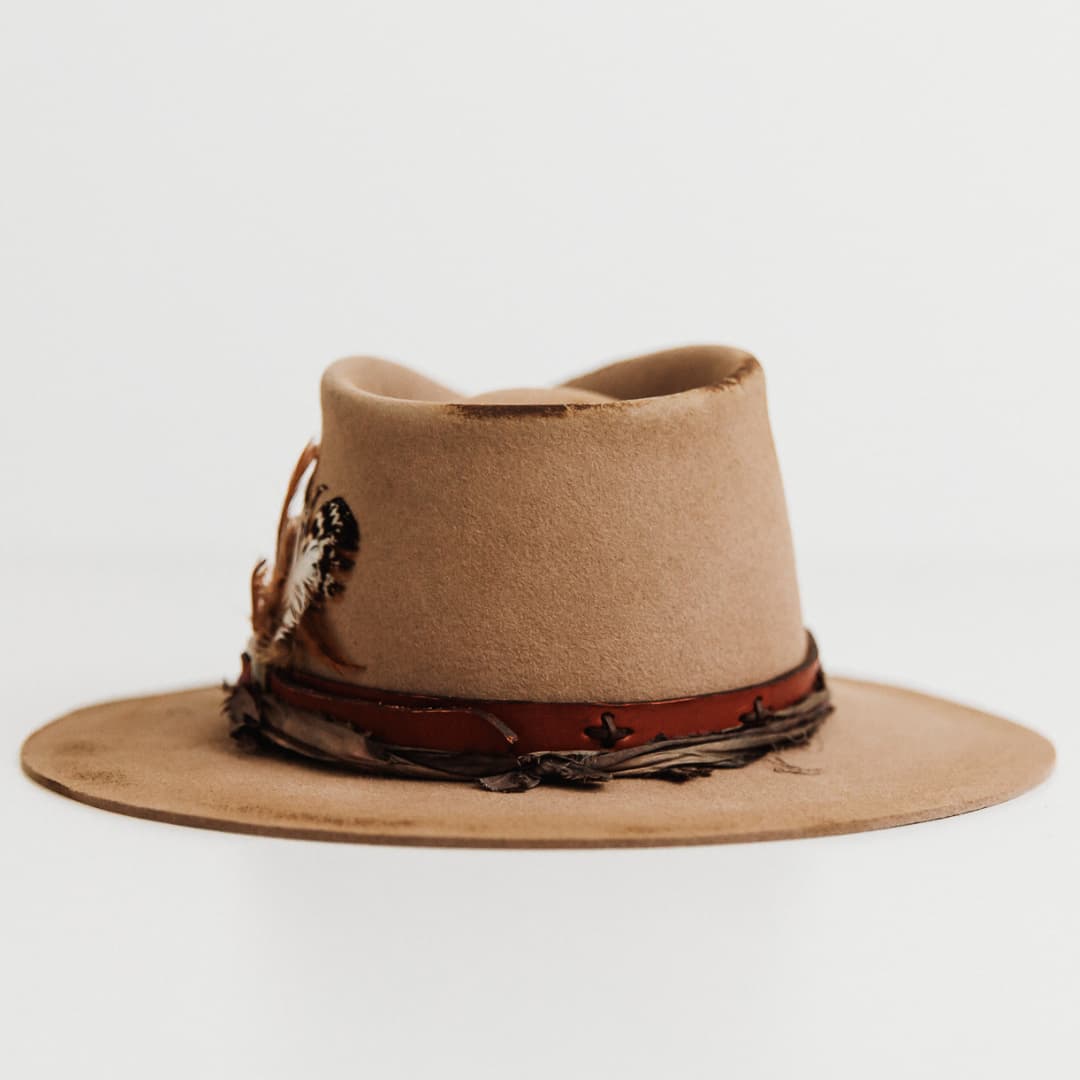 Back view of The Safari distressed Sahara felt hat with leather belt band and hand-stitched cross details.