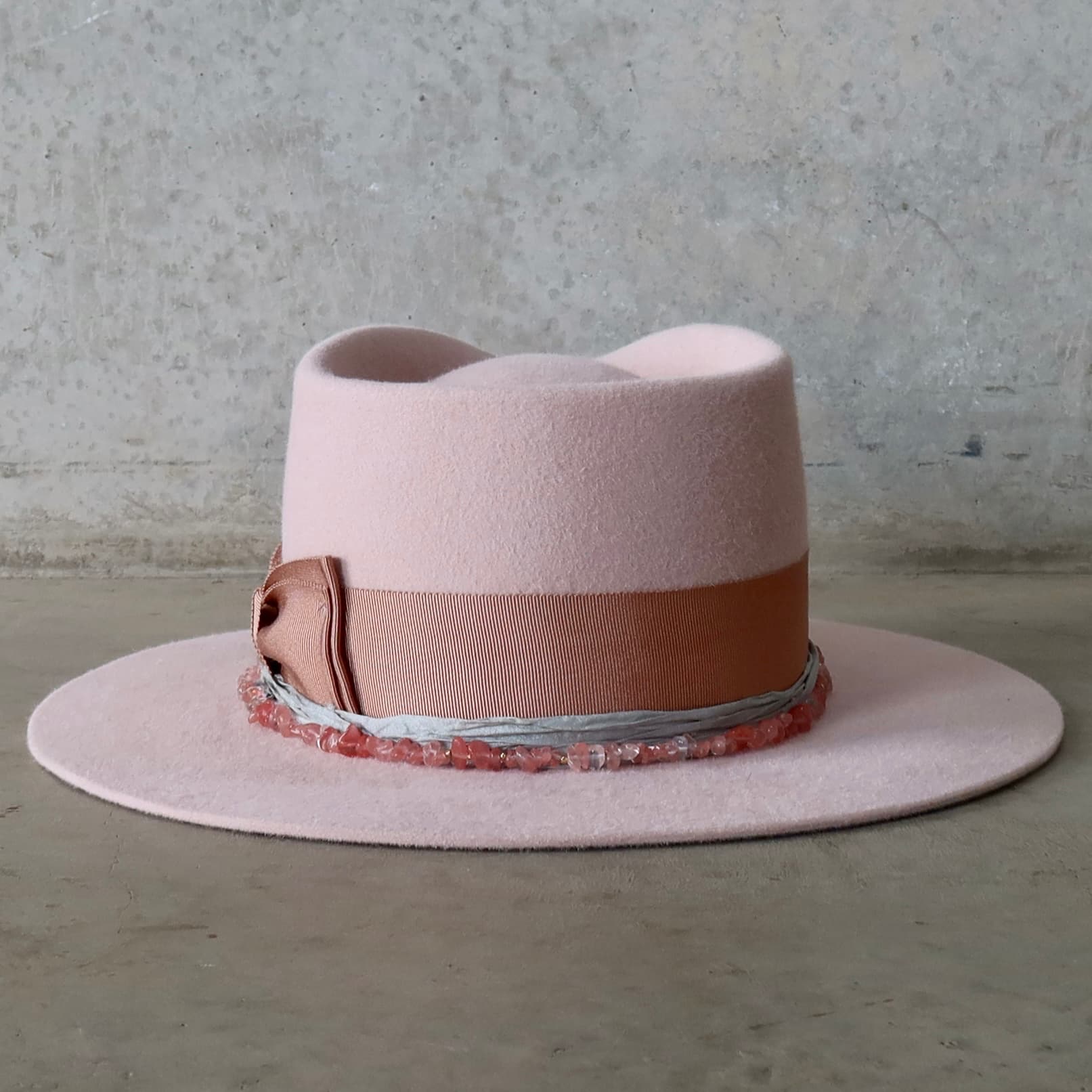 Back view of the Tourmaline Baby Pink felt hat by PHYLLi Designs featuring the dirty rose Japanese grosgrain double bow.
