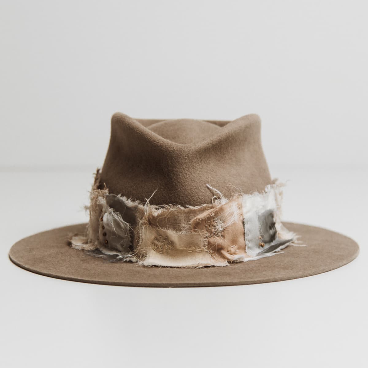 Wabi Limited Edition Sahara felt hat by PHYLLi Designs with Wabi Sabi patch band in linen, cotton, organza and georgette silk.