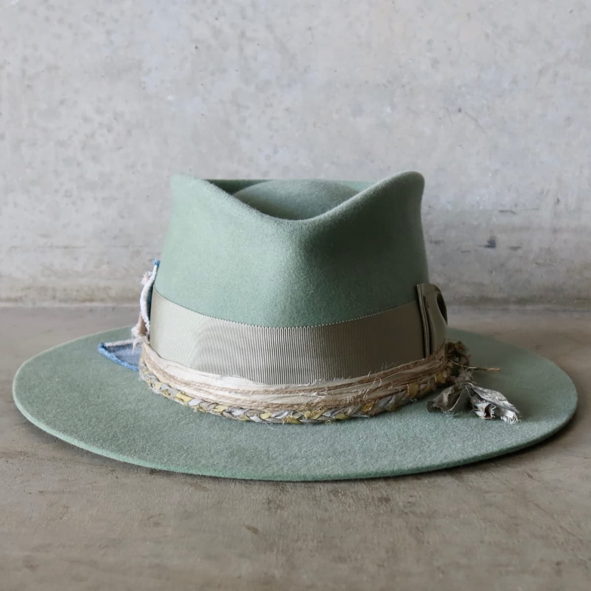 Eucalyptus felt hat Wheatley Limited Edition by PHYLLi Designs with oil green Japanese grosgrain double bow band and plaited sari silk trim.