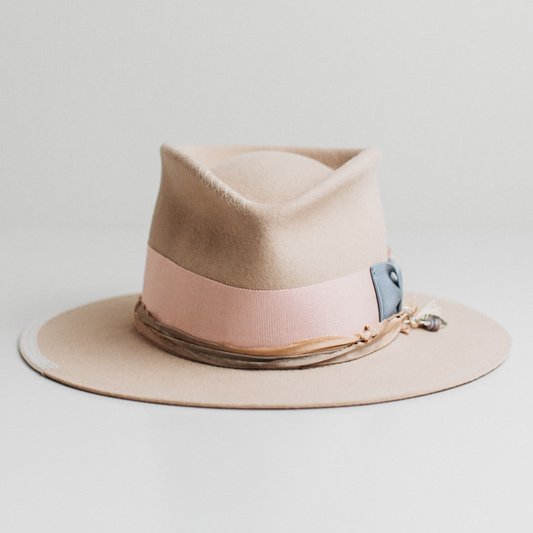 Eleanor beige felt hat by PHYLLi Designs with cornflower Japanese grosgrain bow band and charm cluster.