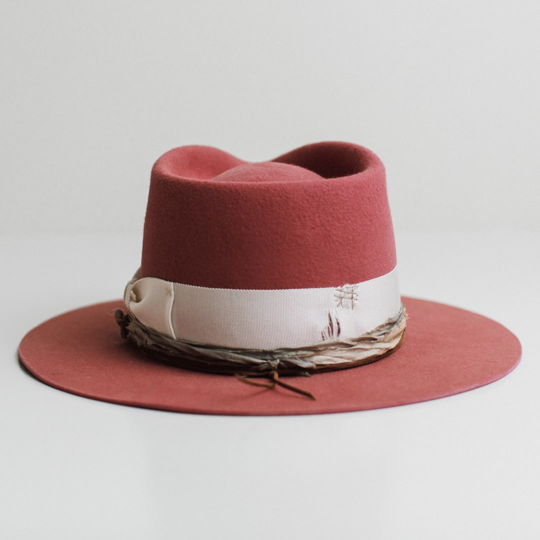 Back view of the Kentucky rose felt hat by PHYLLi Designs featuring distressed ivory grosgrain band with stone darned patch.