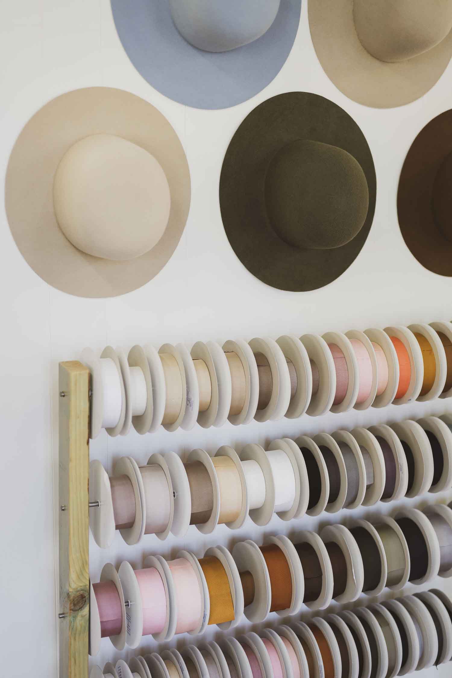 Timber ribbon stand holding Japanese grosgrain trims in the PHYLLi Designs studio.