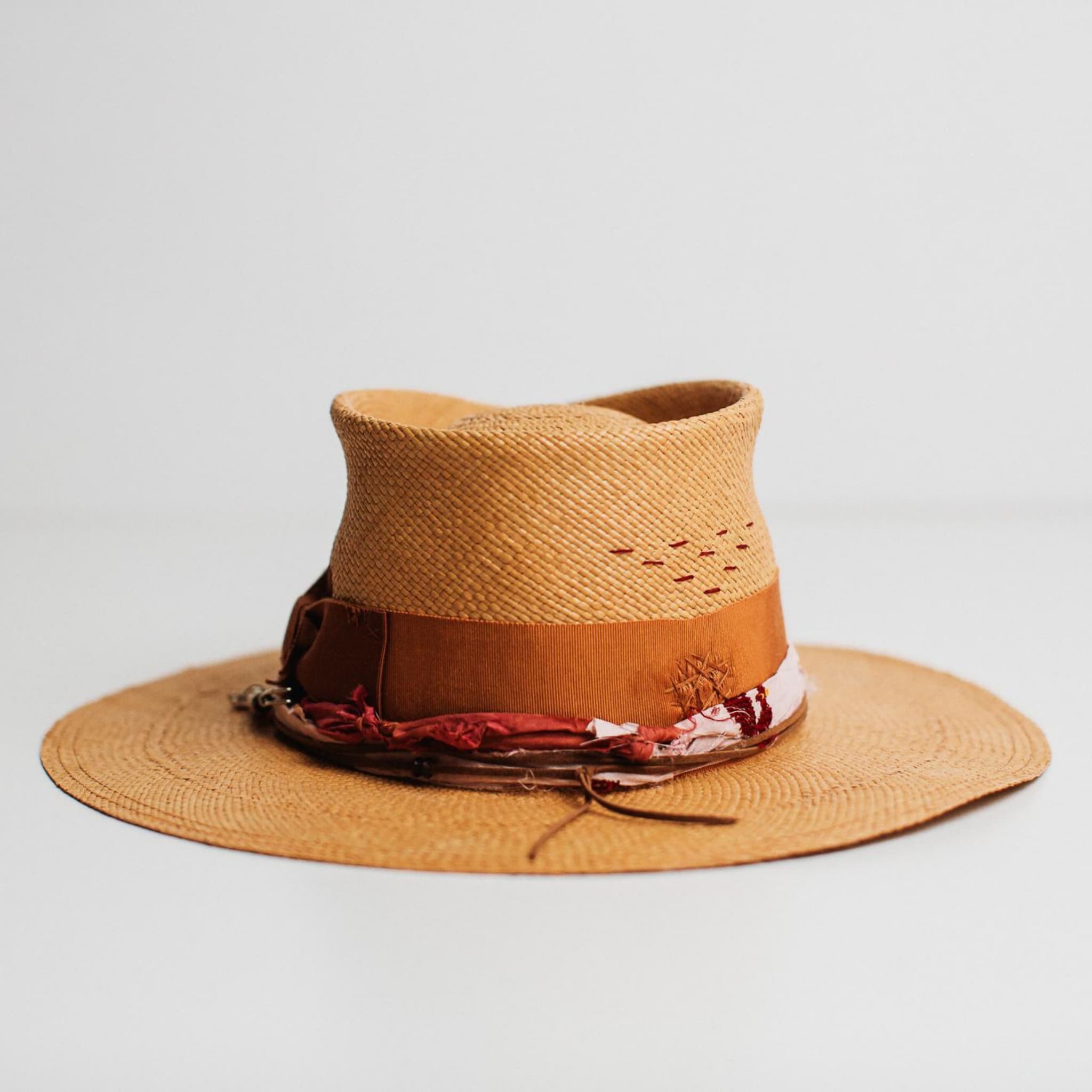 Back view of the Barbados biscuit Panama hat by PHYLLi Designs with burgundy hand-stitched detail.