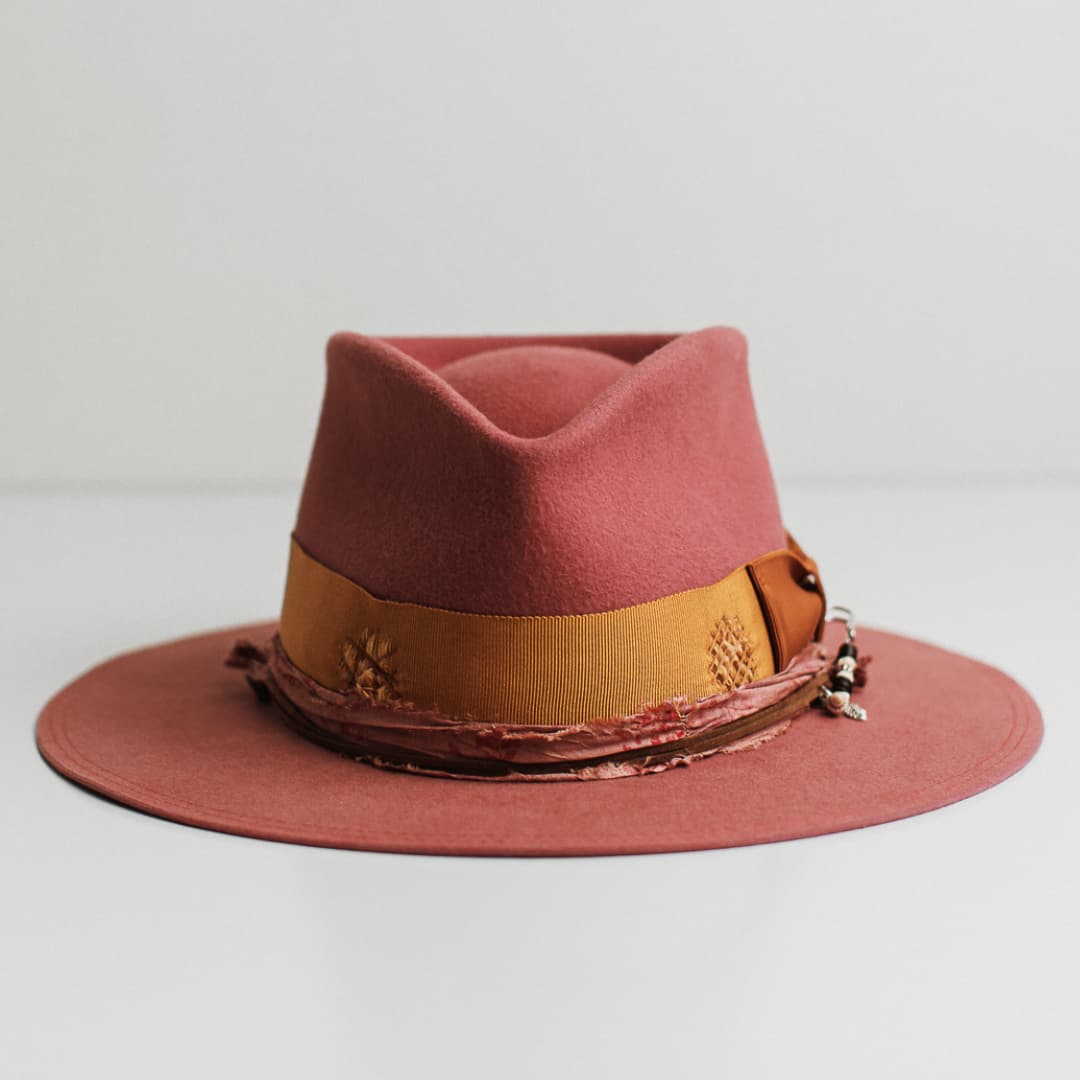 Barbados Rose rose felt hat by PHYLLi Designs with distressed turmeric Japanese grosgrain band, rust bow and candy and rose sari silk trimming.