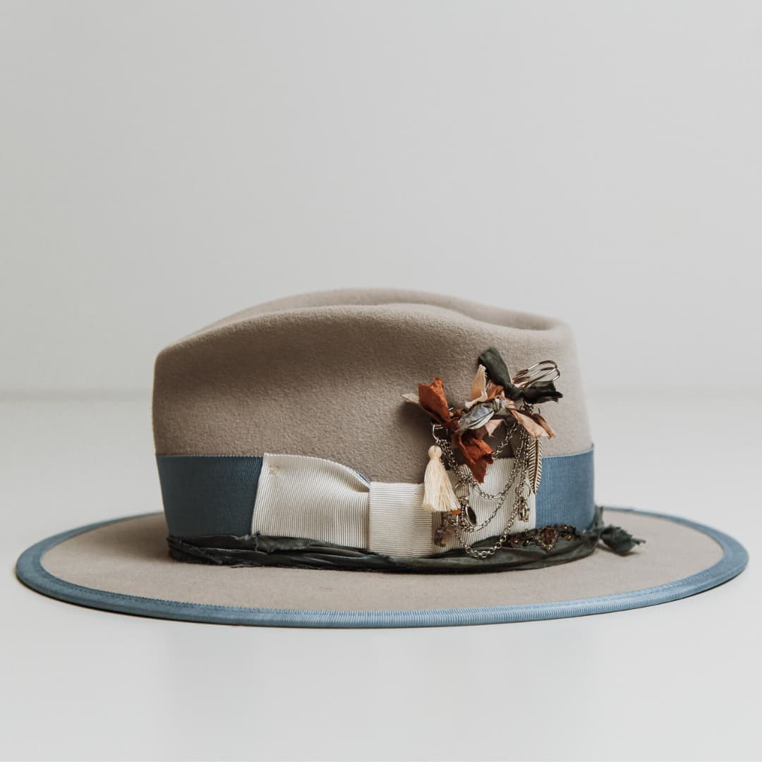 Side view of Bleu de France felt hat with Cornflower grosgrain band and Smokey Blue sari silk trim.