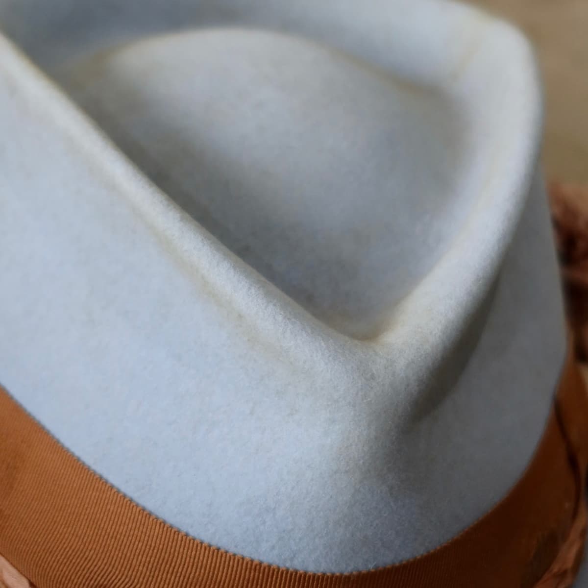 Close up detail of the Blue Bloom felt hat showing the sculpted crown shape in crystal blue rabbit felt.