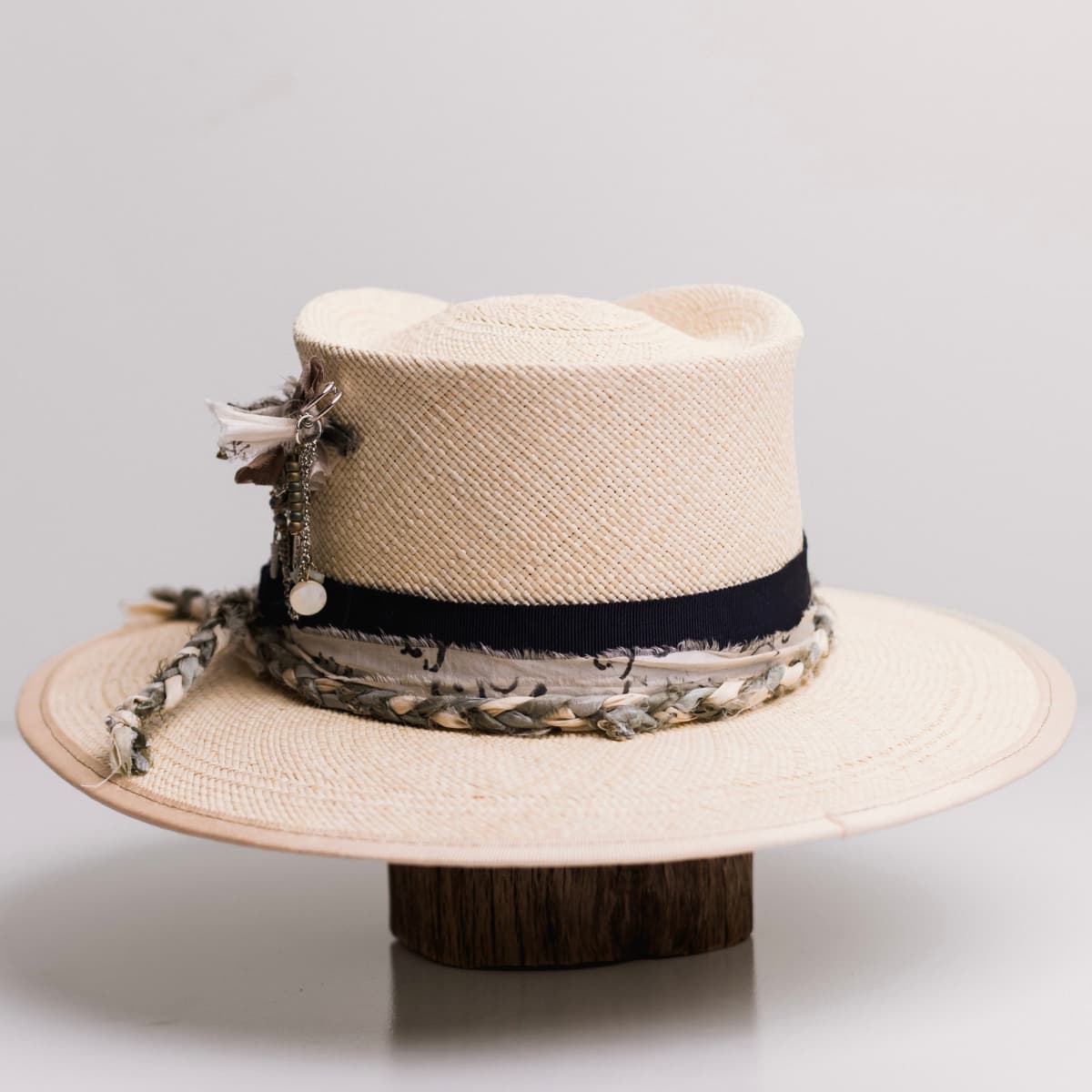 Back view of the Blue Jean Natural Panama hat by PHYLLi Designs featuring sand Japanese grosgrain brim trim stitched in olive.