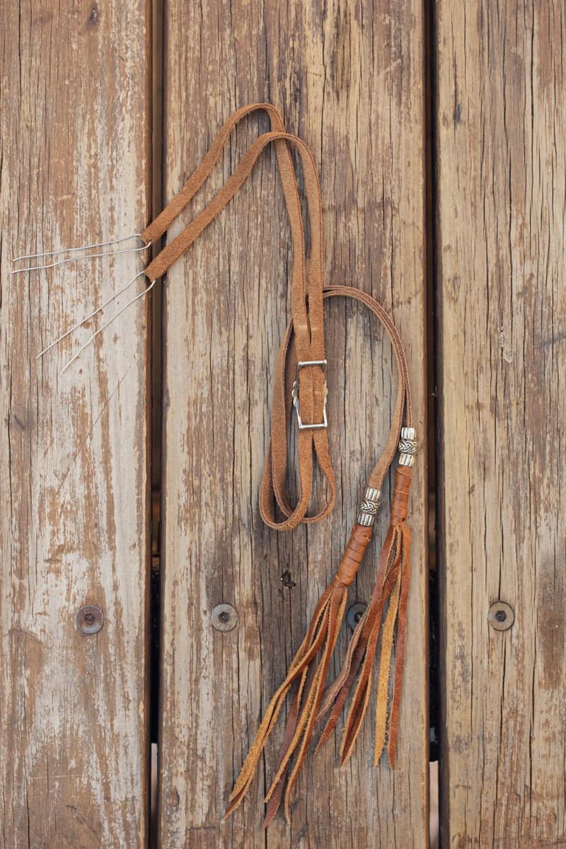 Detail
Close up detail of the PHYLLi x Buffalo Girl Stampede Strap showing small concho slider used to tighten the strap.