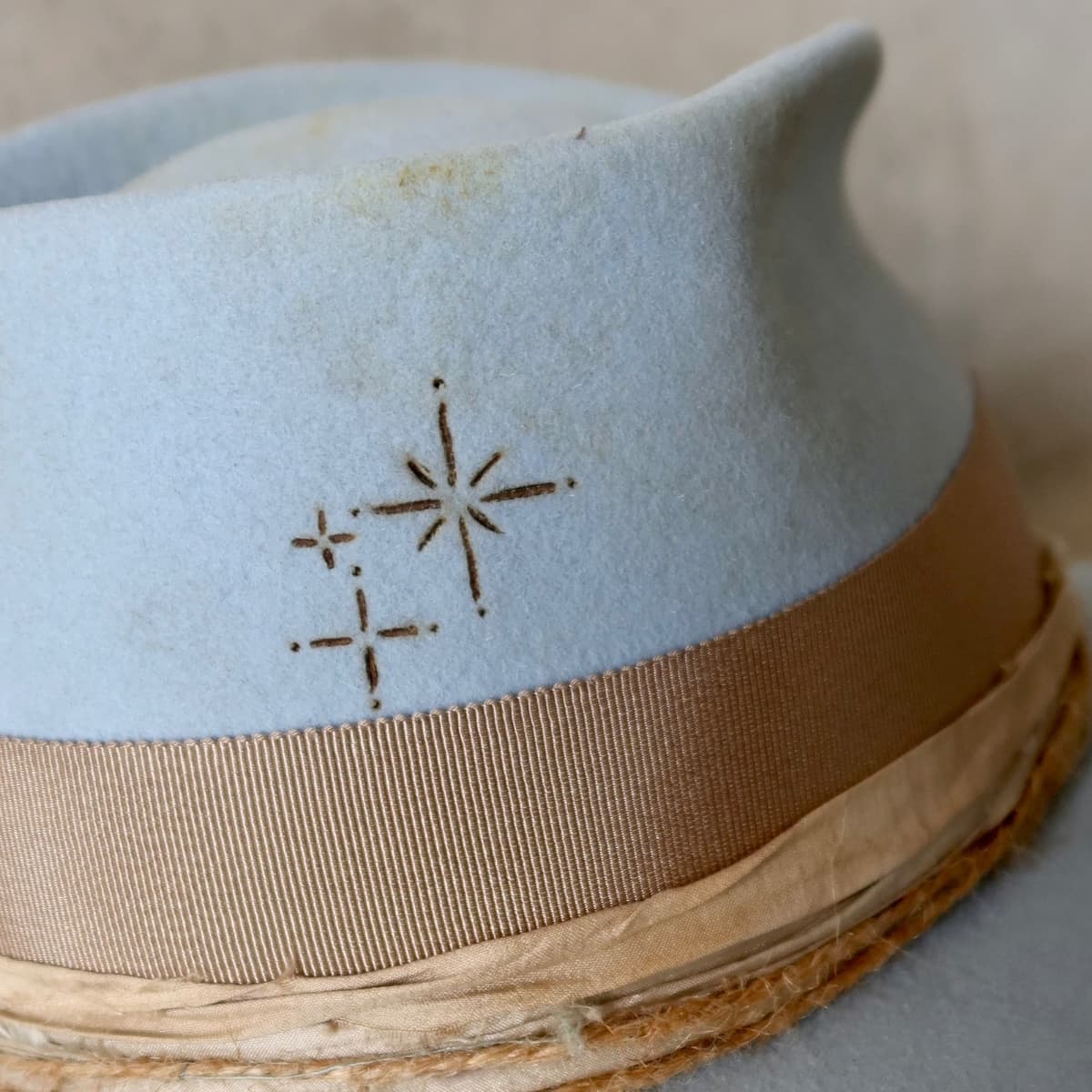 Close up detail of the Clareville Limited Edition felt cowboy hat showing burnt branded patterns on the brim.