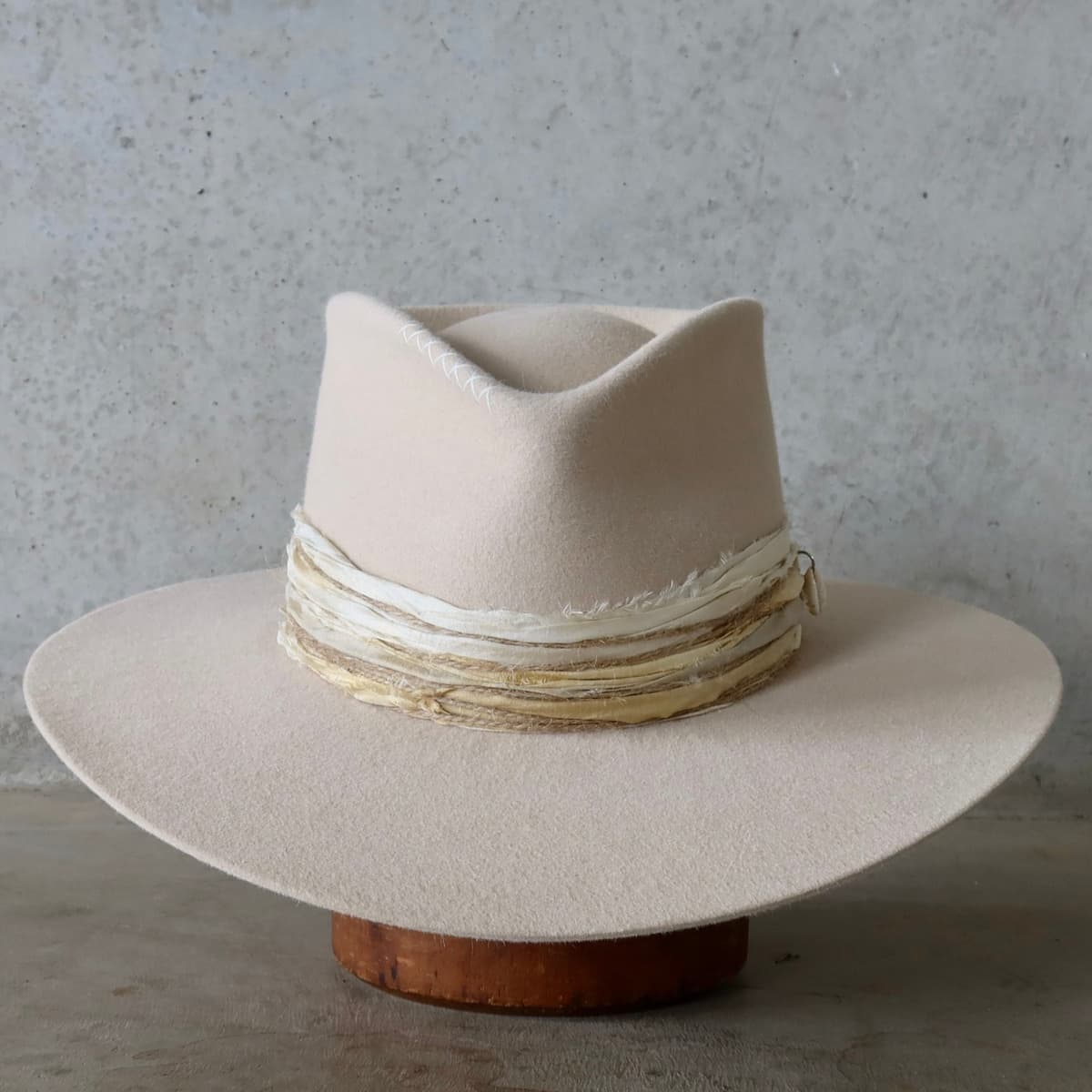 Beige felt hat Coastline by PHYLLi Designs with ivory Japanese grosgrain band and layered sari silk trims.