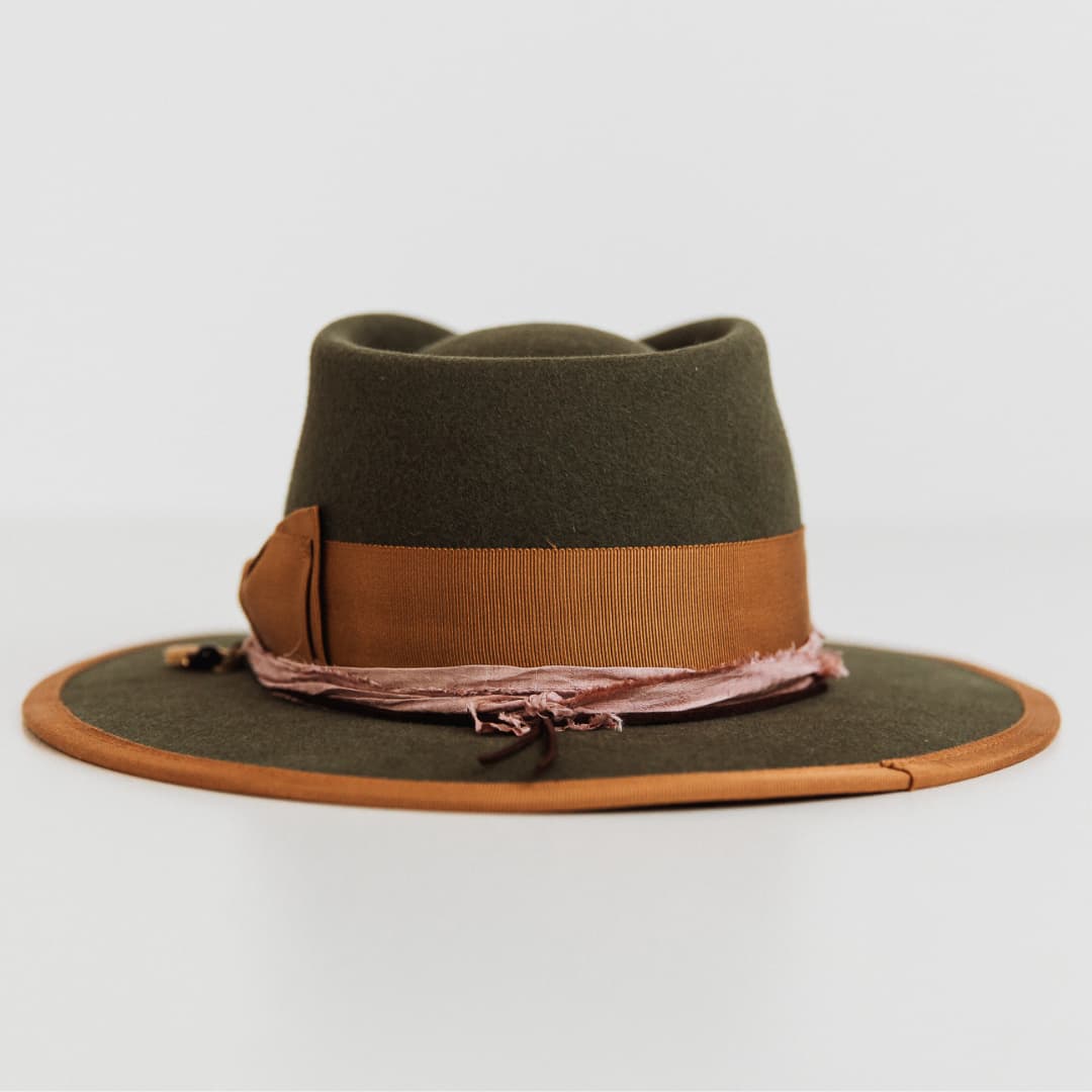 Back view of the Feuille Morte Military felt hat by PHYLLi Designs with copper grosgrain band and brim trim.