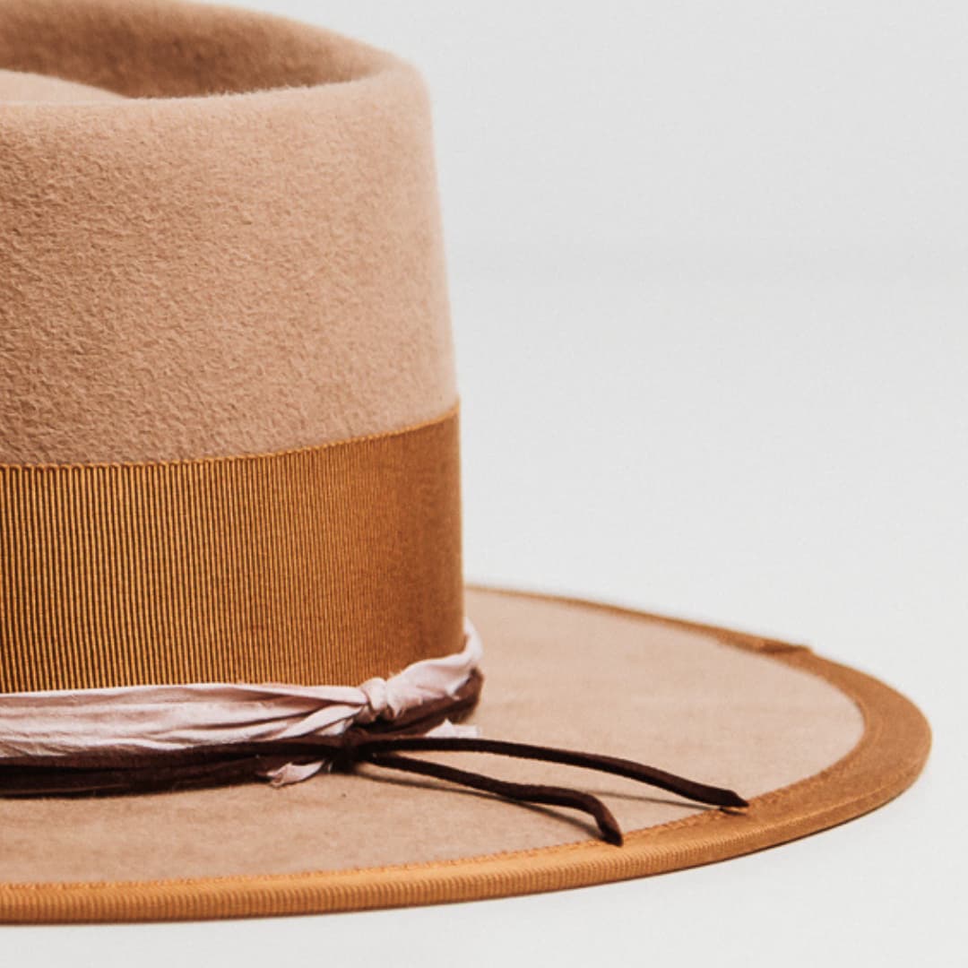 Detail of Feuille Morte Camel felt hat showing Rose sari silk trim and Chocolate suede string.