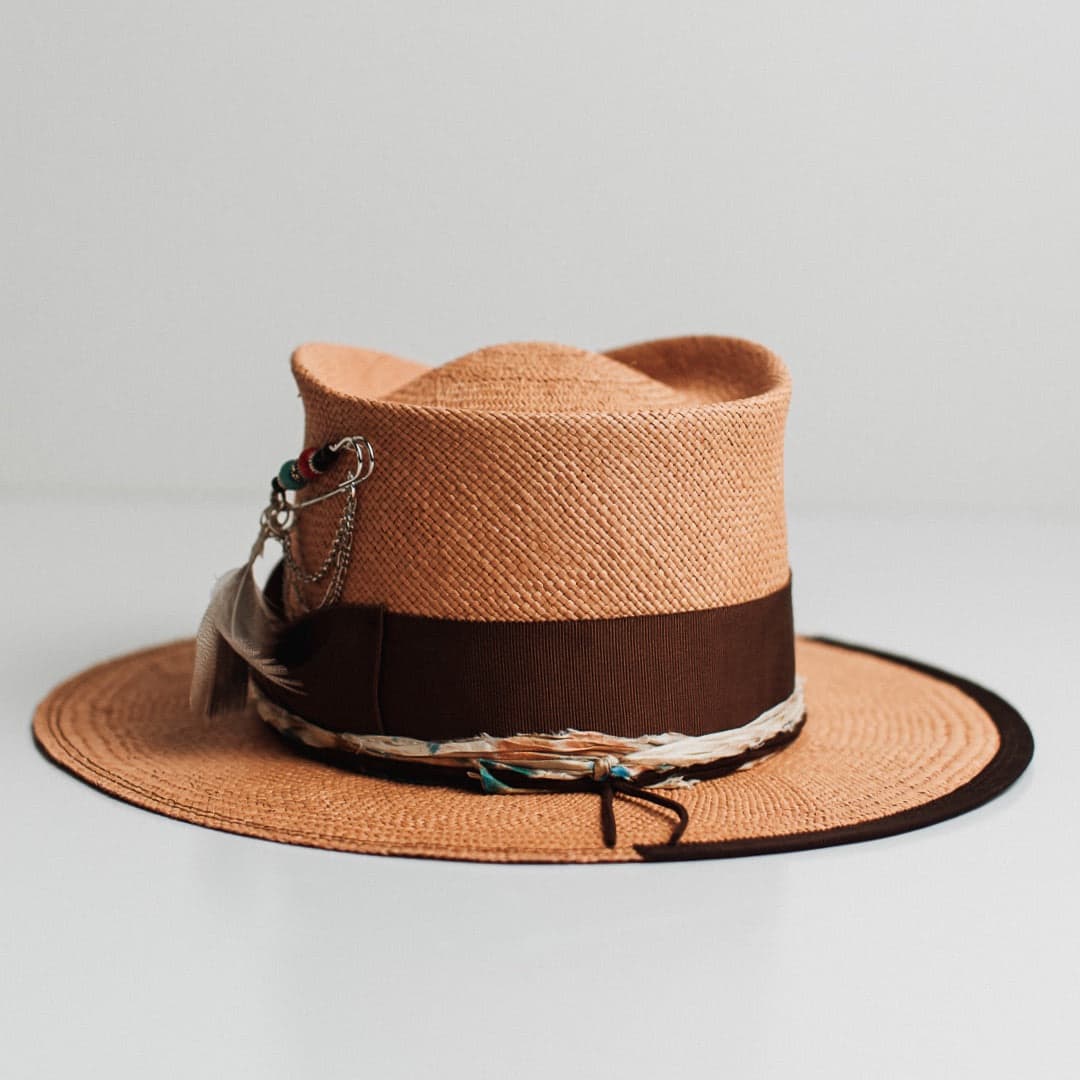 Back view of the Fly Fisher Panama biscuit Panama hat by PHYLLi Designs featuring chocolate suede string and speckled sari silk trimming.