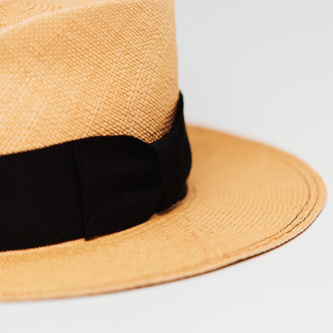 Detail of Holiday Biscuit Panama hat showing Black grosgrain bow band.