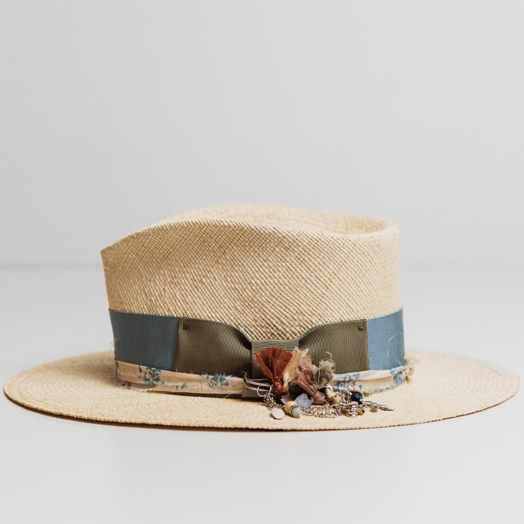 Side view of Hunter Panama hat with Cornflower grosgrain band, sari silk trim and chunky hat pin.