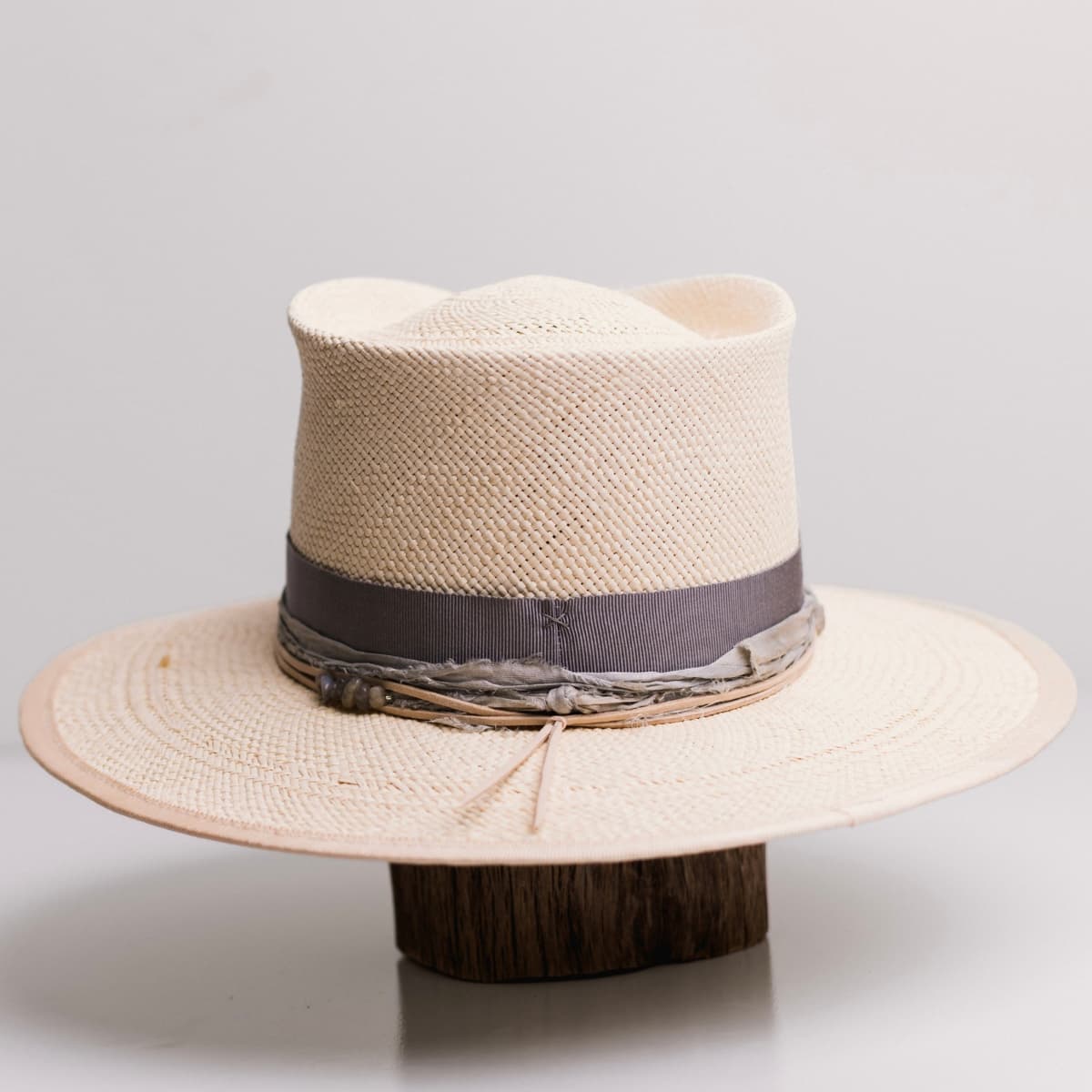 Back view of the La Journee Natural Panama hat by PHYLLi Designs featuring sand Japanese grosgrain brim trim stitched in dove.