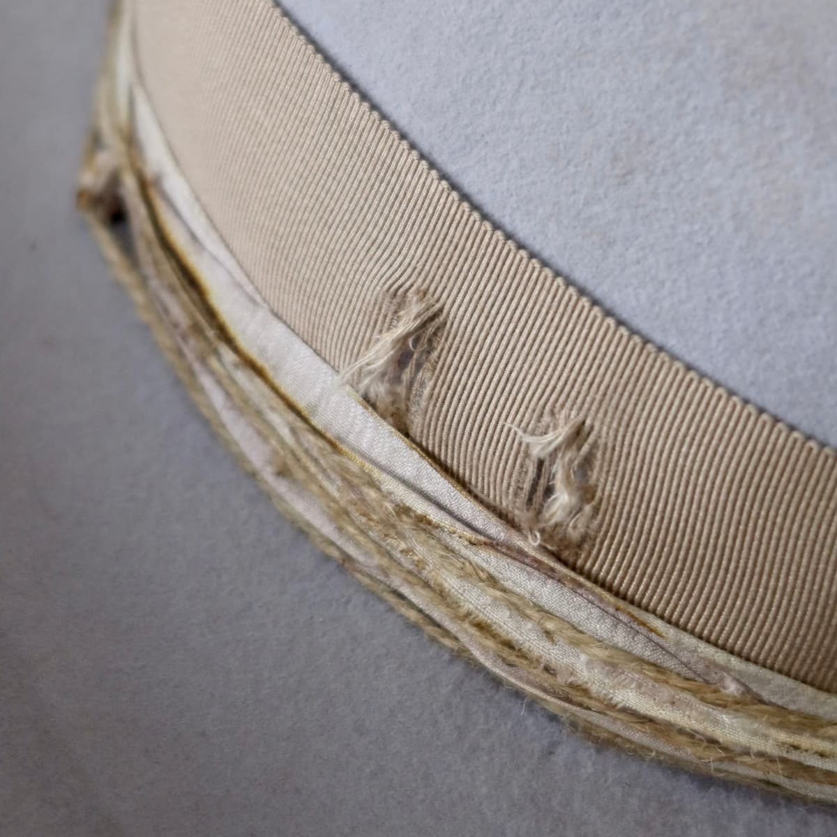 Close up detail of the Lacey cowgirl hat showing distressed grosgrain band with frayed detailing.