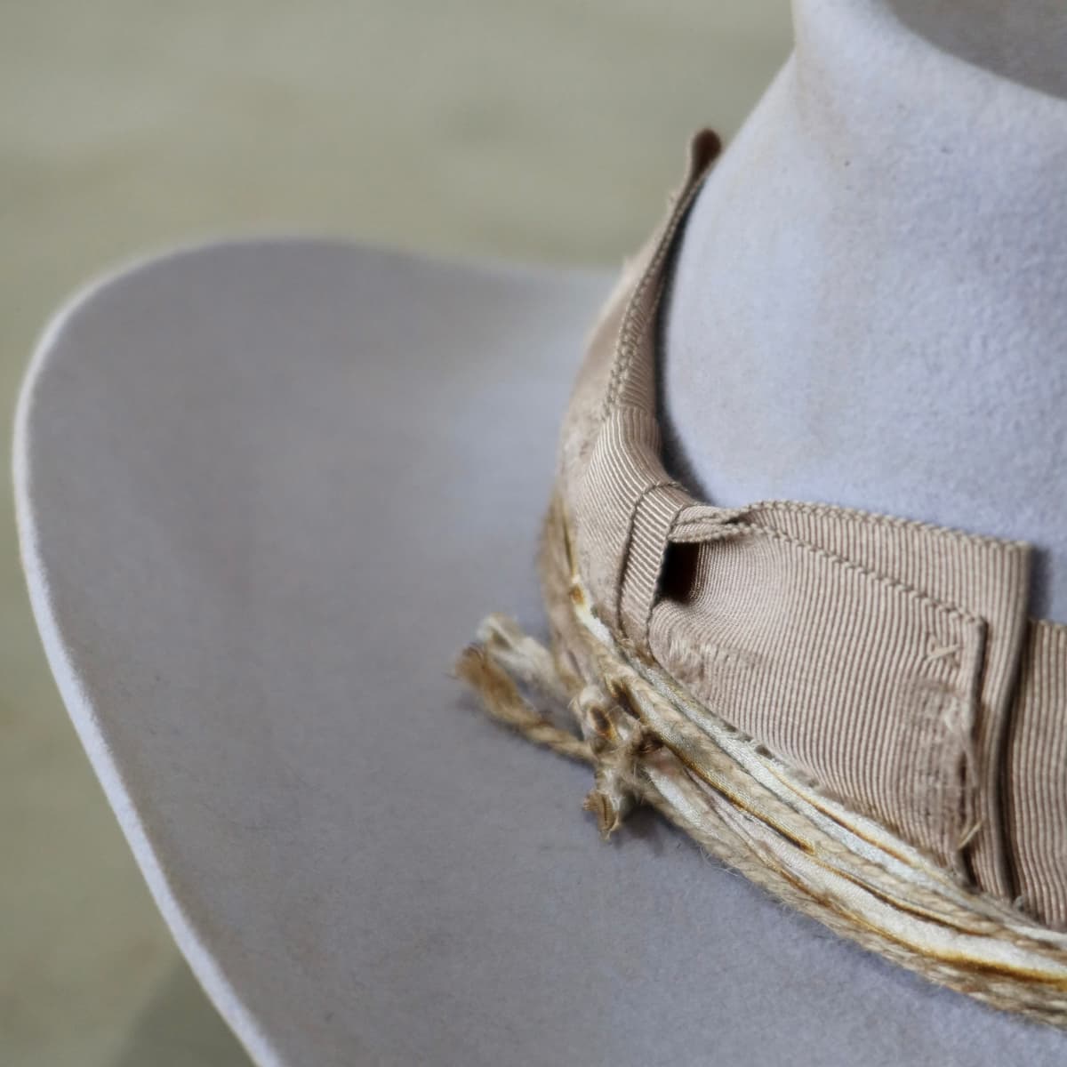 Close up detail of the Lacey cowgirl hat showing sari silk trim and twine wrap layers.