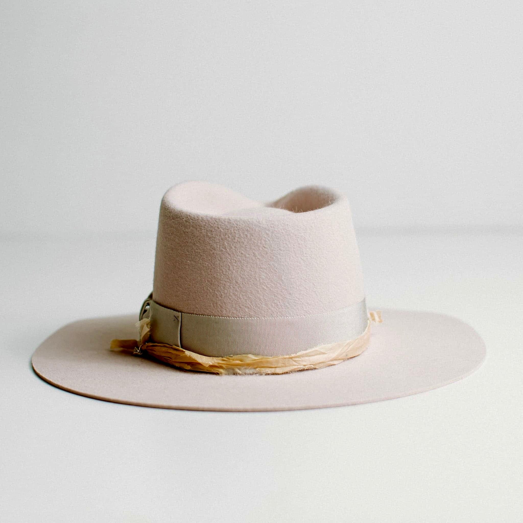 Back view of light lilac felt hat with dove grey grosgrain band and cream sari silk trim by PHYLLi Designs.