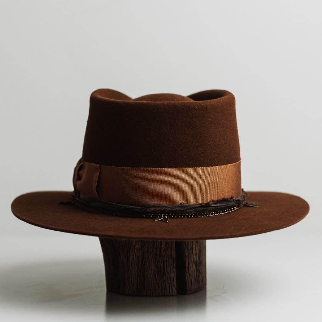 Back view of the Maple caramel felt hat by PHYLLi Designs featuring bronze crown chain with carved leaf clusters.