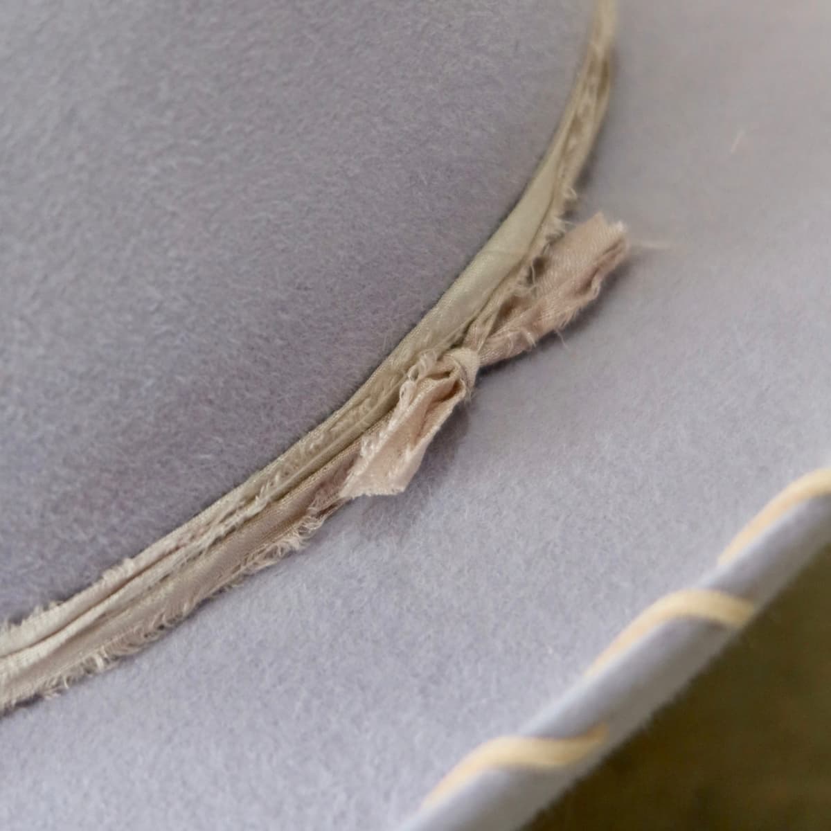 Close up detail of the Nevada cowboy hat showing tonal lilac silk yarn wraps tied around the crown.