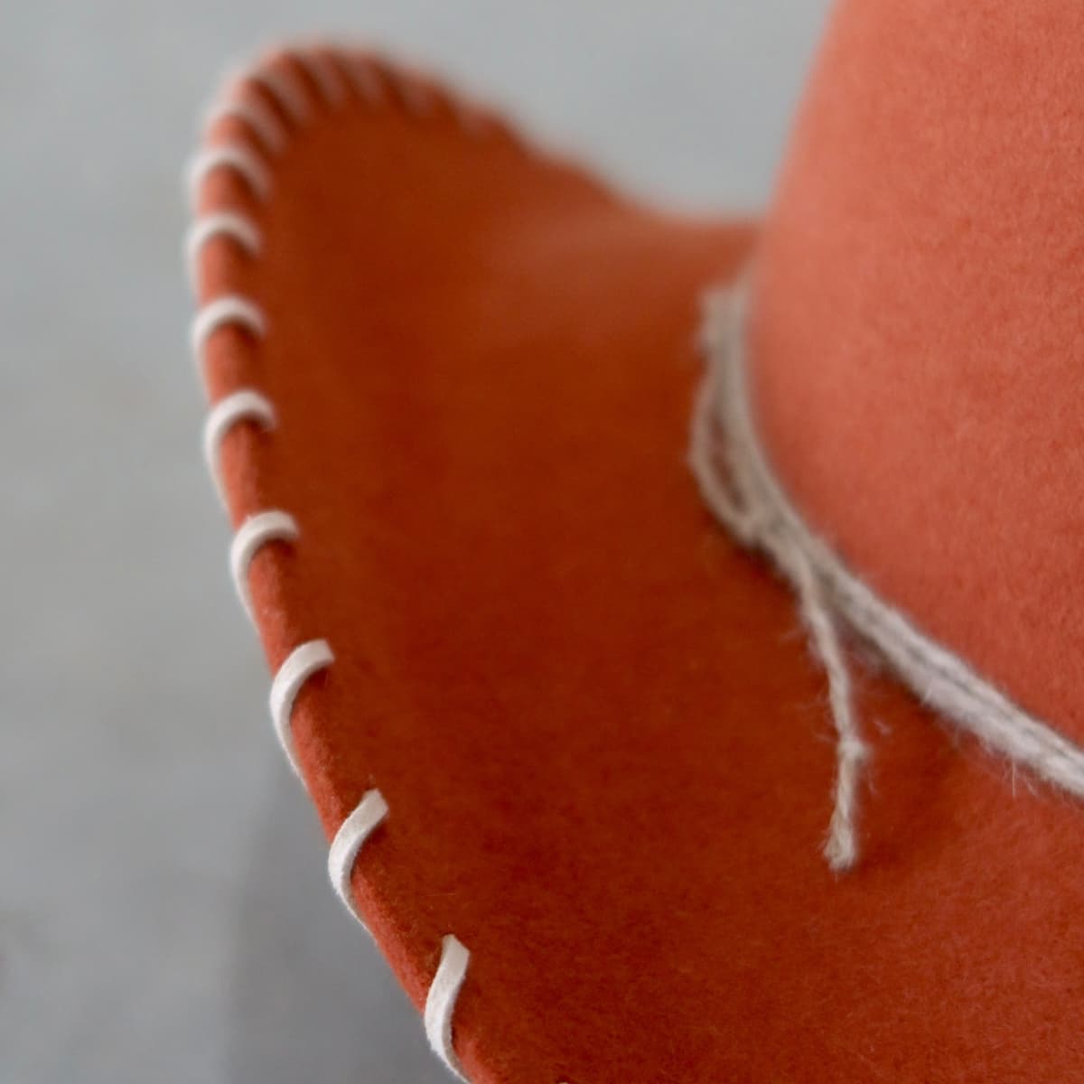 Close up detail of the Nevada cowboy hat showing textured spiced pumpkin felt with contrast suede brim lacing.