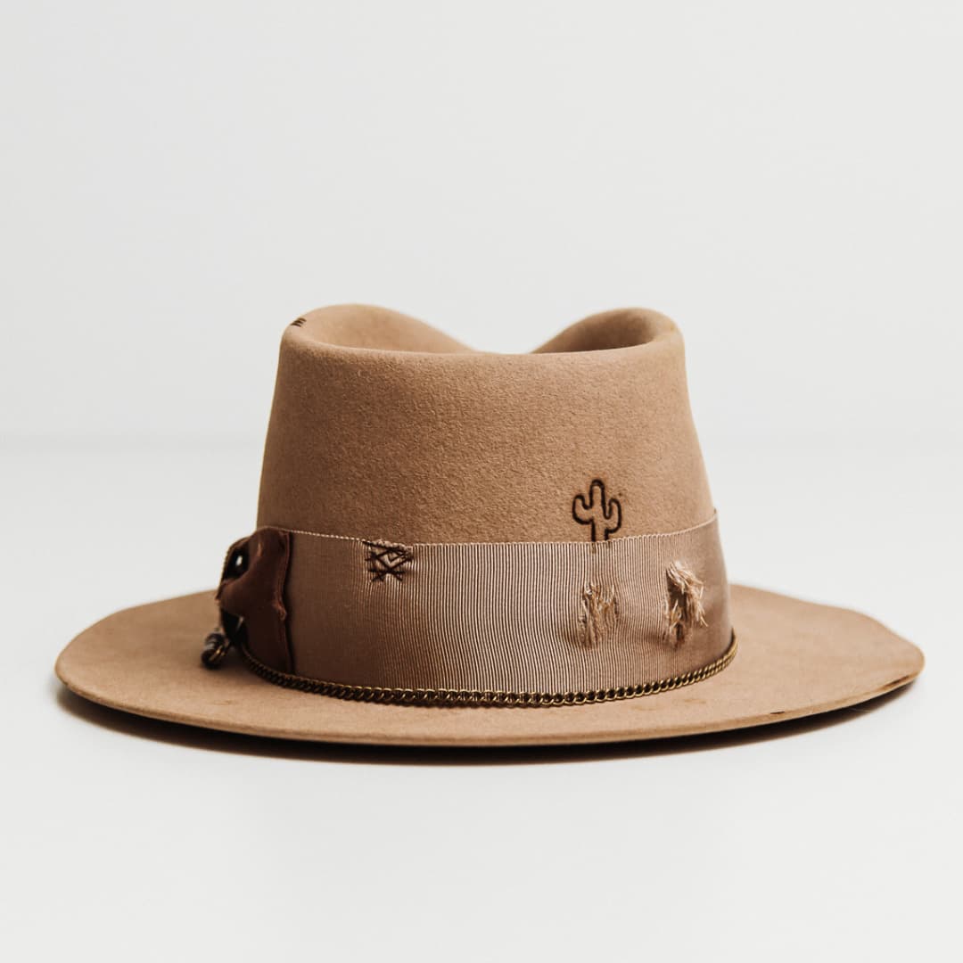 Back view of the Normie sahara felt hat by PHYLLi Designs featuring burnt branded cactus on the crown.