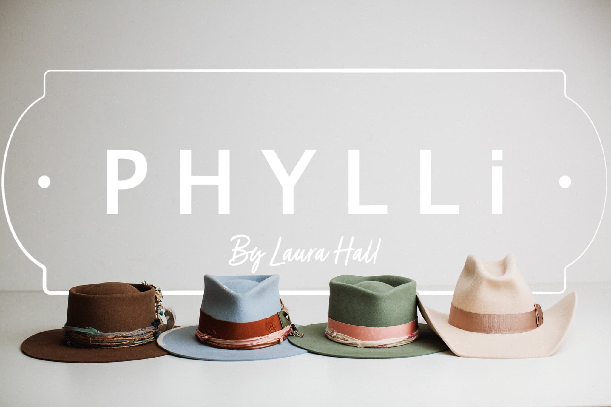 PHYLLi Designs gift card product image featuring four handcrafted felt hats in brown, blue, green and beige displayed beneath PHYLLi By Laura Hall logo.