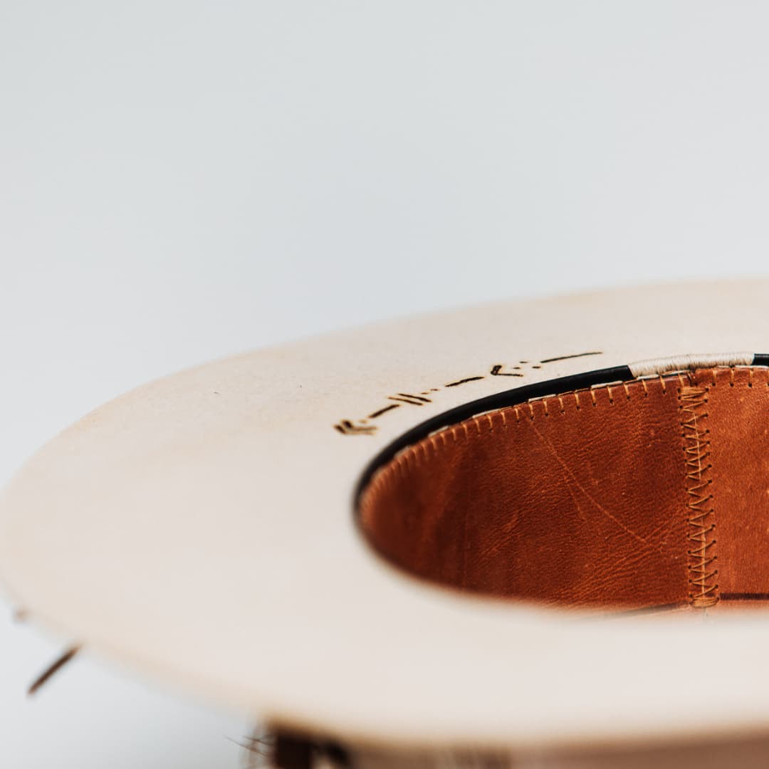 Close up detail of the Roadie felt hat showing leather sweatband and under brim branding.