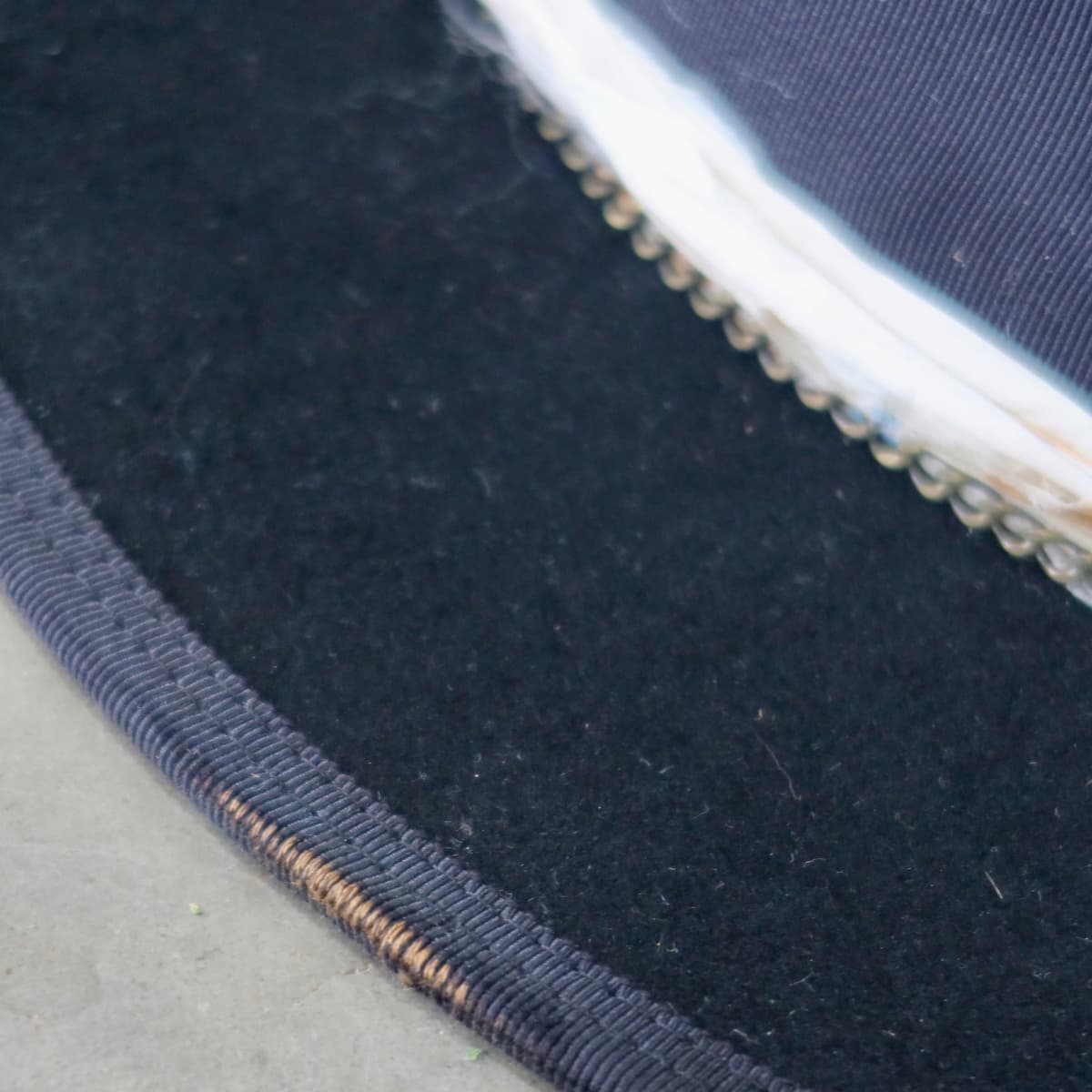 Close up detail of the Saint felt hat showing distressed black grosgrain brim trim and double brim stitch.