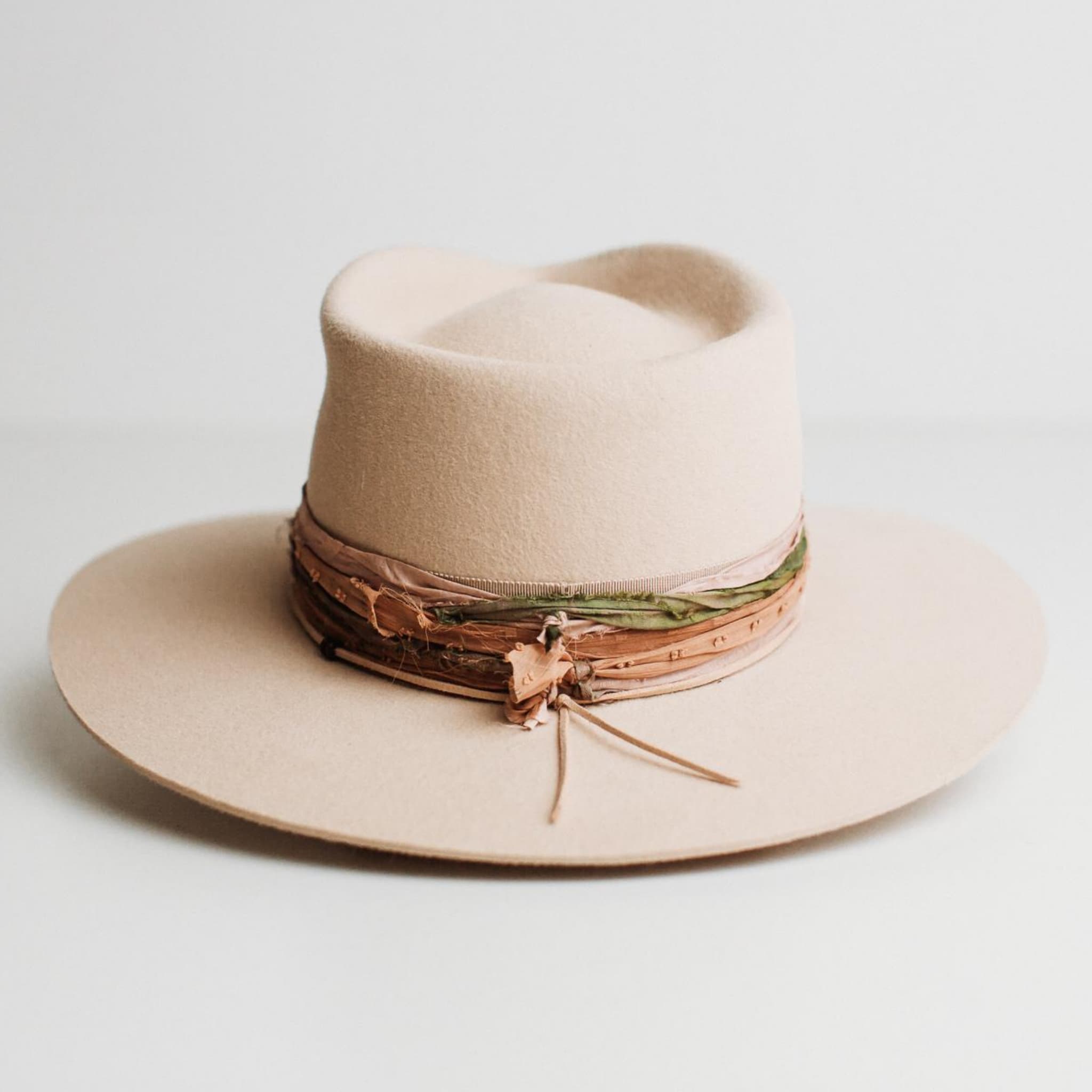 Back view of Santa Fe Summer beige felt hat by PHYLLi Designs showing plaster grosgrain band and sari silk trim.