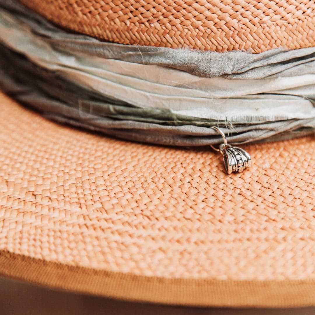 Close up detail of the Santa Fe Winter Panama hat showing sari silk trimming and silver pendant charm.
