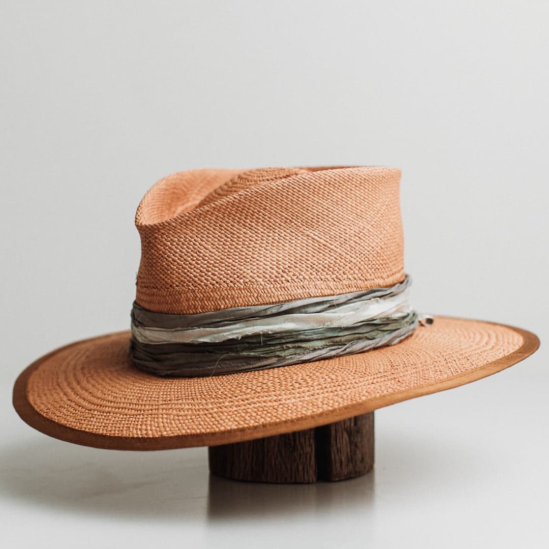 Front left angle of the Santa Fe Winter Panama biscuit Panama hat by PHYLLi Designs with copper Japanese grosgrain band and layered sari silk trimming.