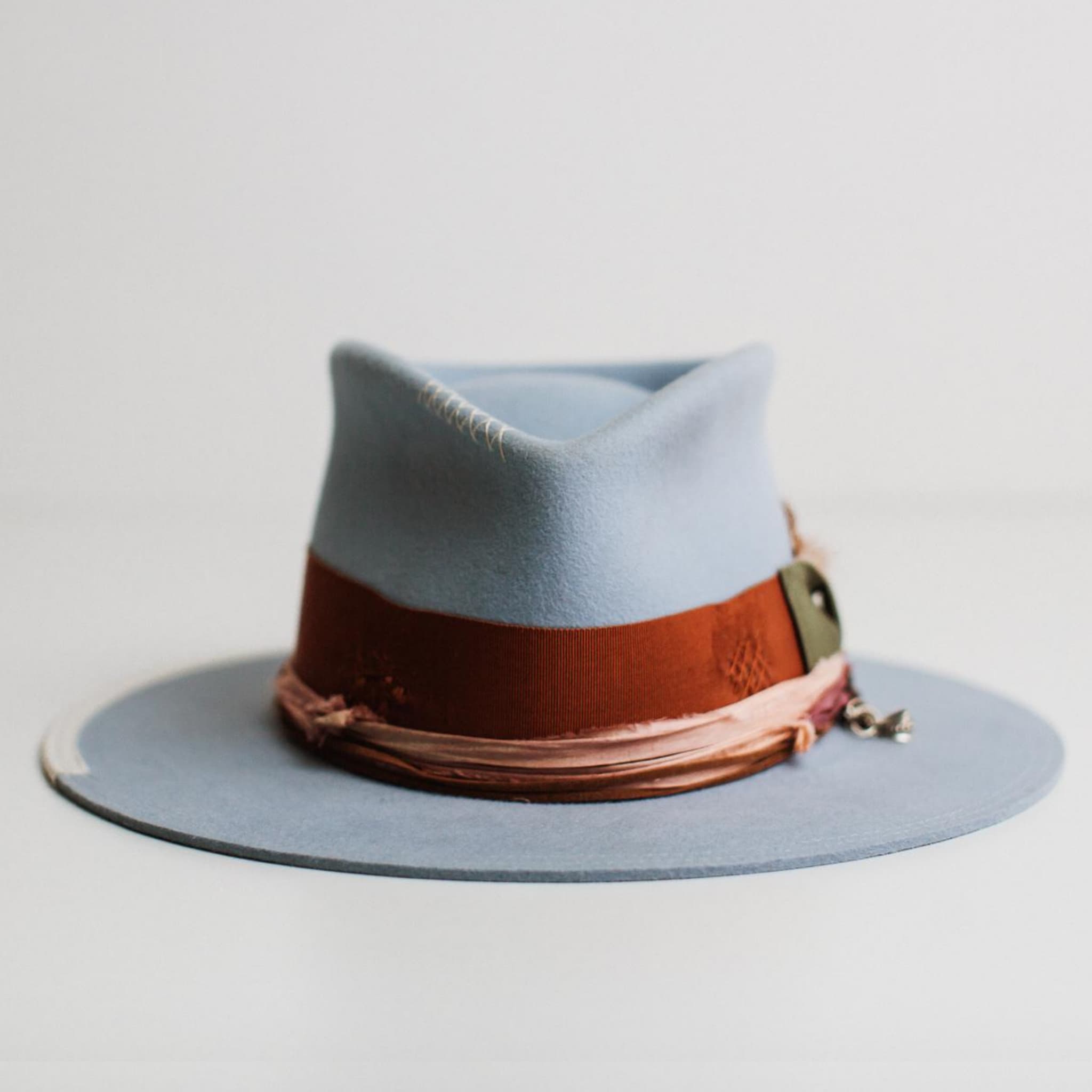 Front view of Santa Monica crystal blue felt hat by PHYLLi Designs with rust grosgrain band and sari silk trim.