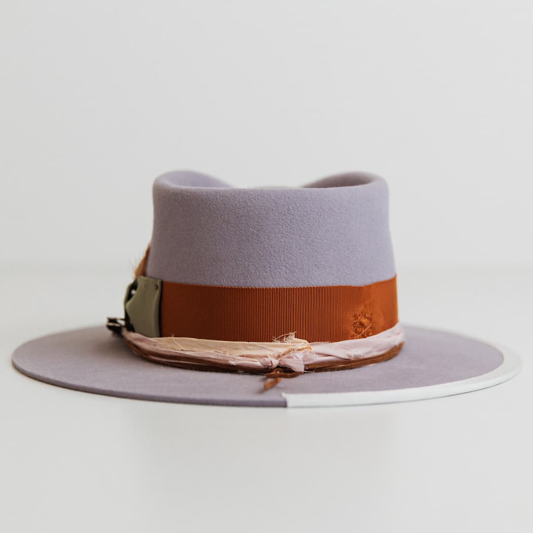 Back view of Santa Monica Lilac felt hat by PHYLLi Designs with rust grosgrain band and sari silks.