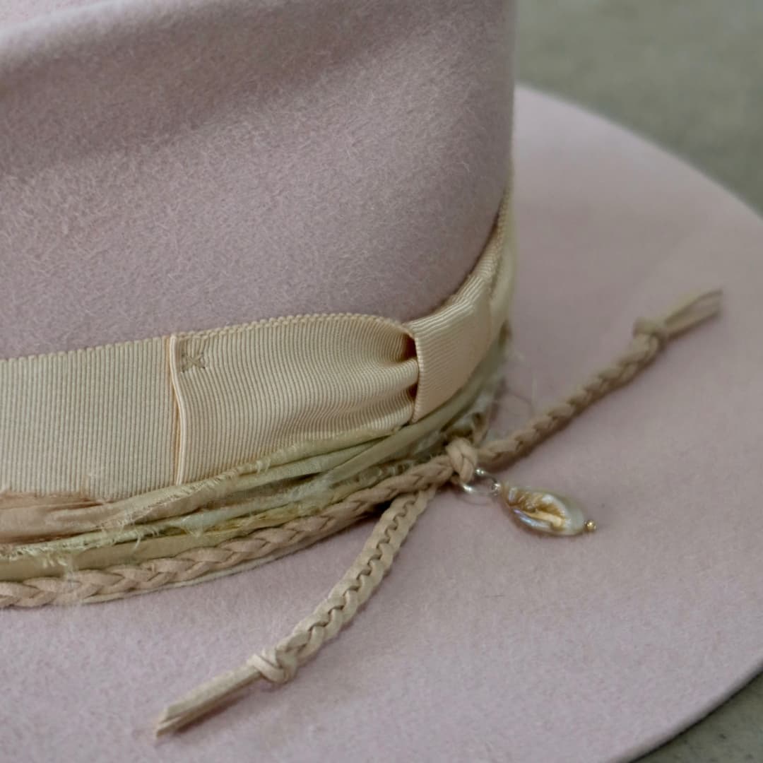 Close up detail of the Sorbet felt hat showing sand Japanese grosgrain bow band.