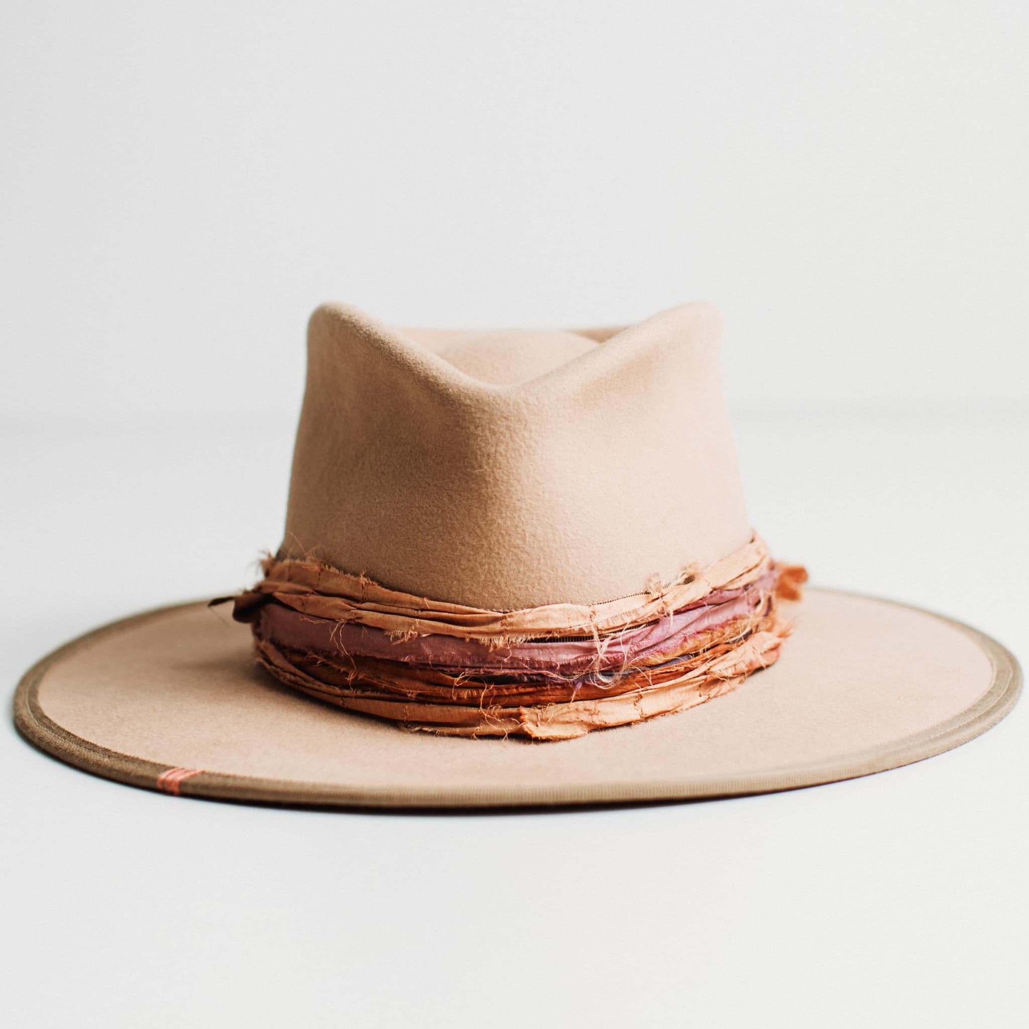Sunset sand felt hat with vintage French grosgrain band, nude brim trim and sunset-toned sari silk trim by PHYLLi Designs.