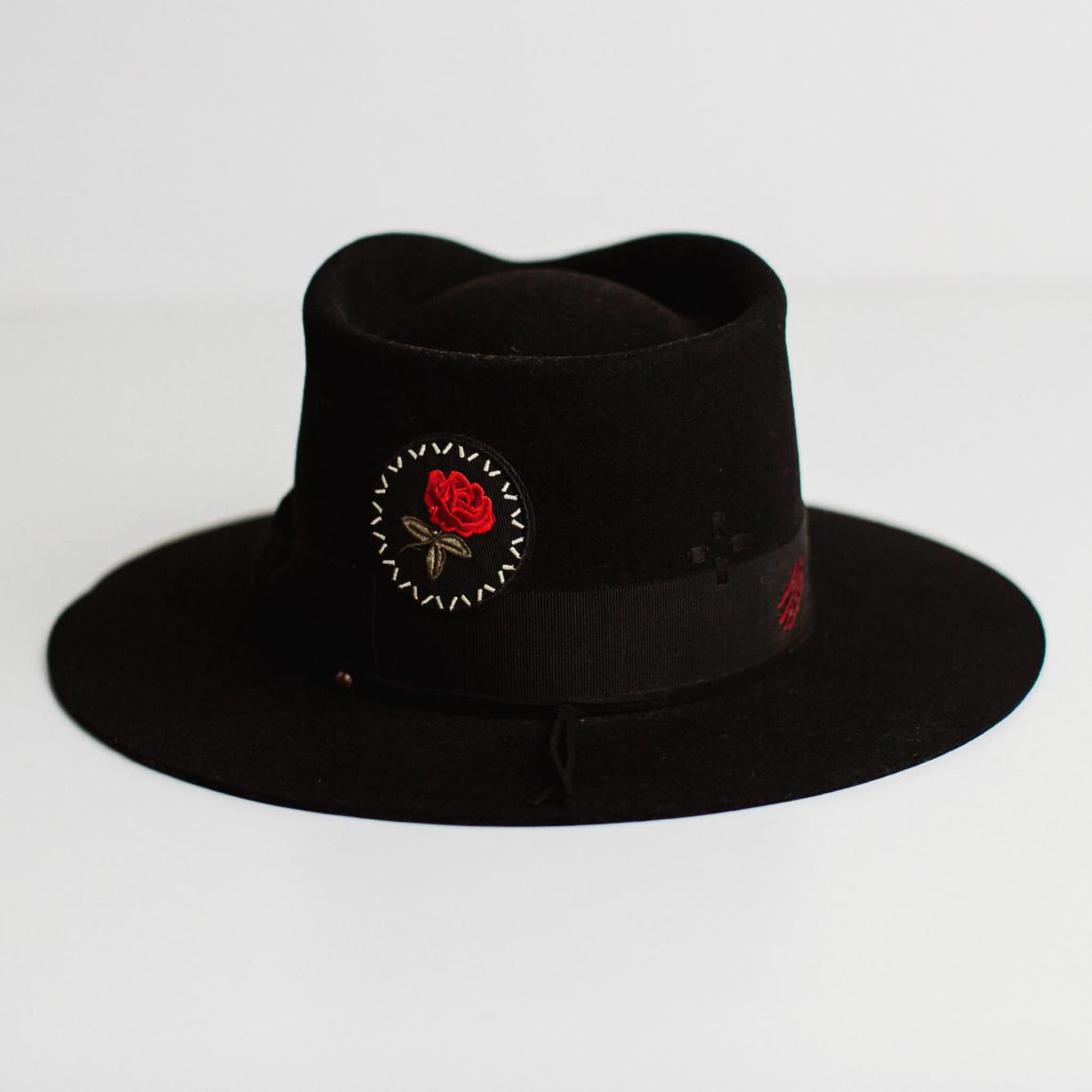 Back view of The Betty black felt hat by PHYLLi Designs featuring hand-stitched cross detail in black.