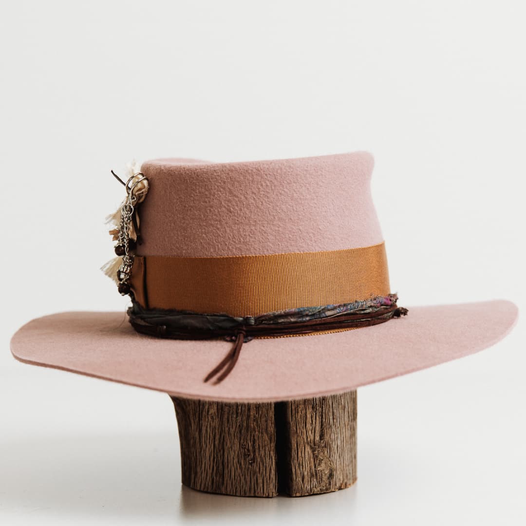 Back angle of The Blush felt hat by PHYLLi Designs with copper grosgrain band and suede string with wooden beading.