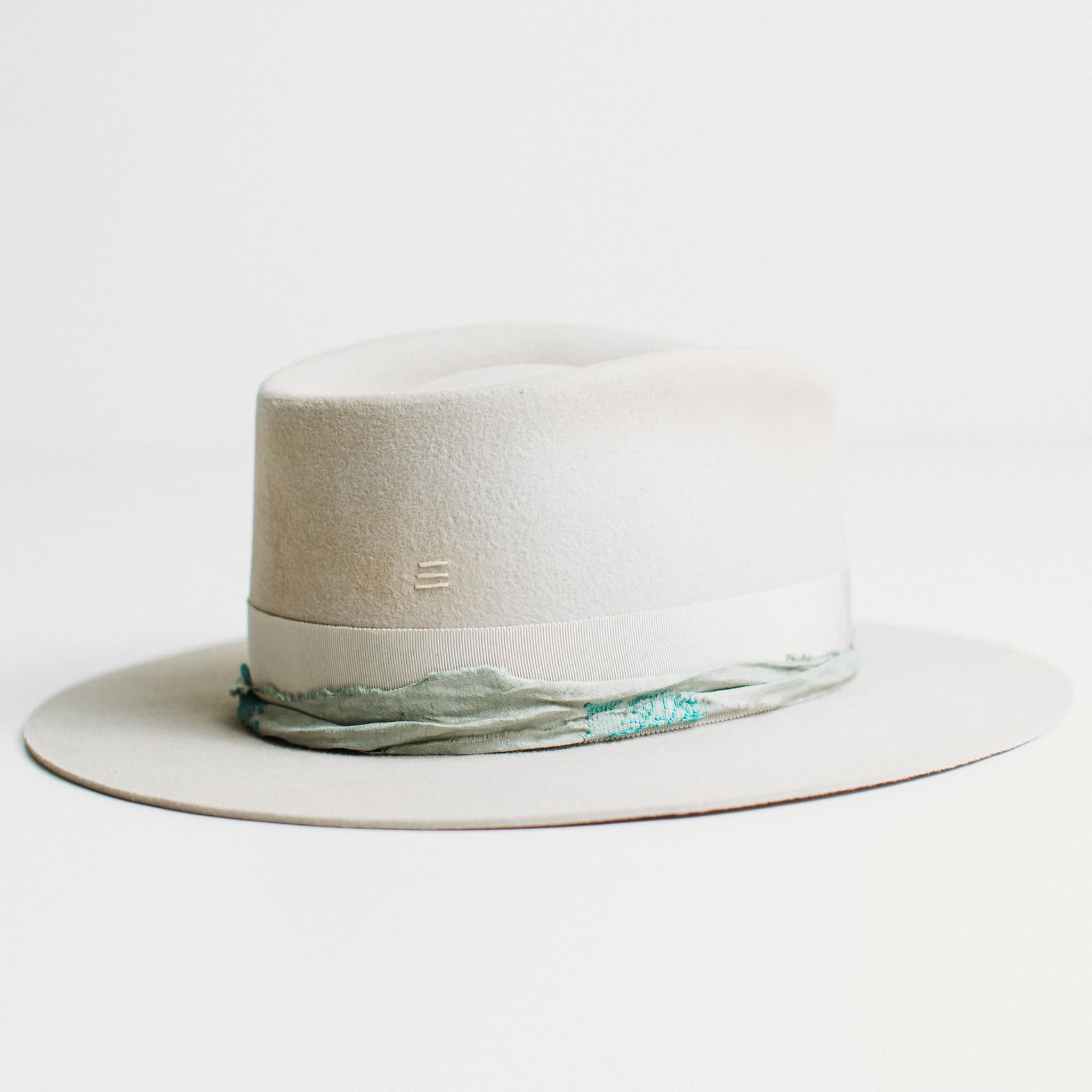 Right side view of dove felt hat with Japanese grosgrain band and sari silk trim by PHYLLi Designs.