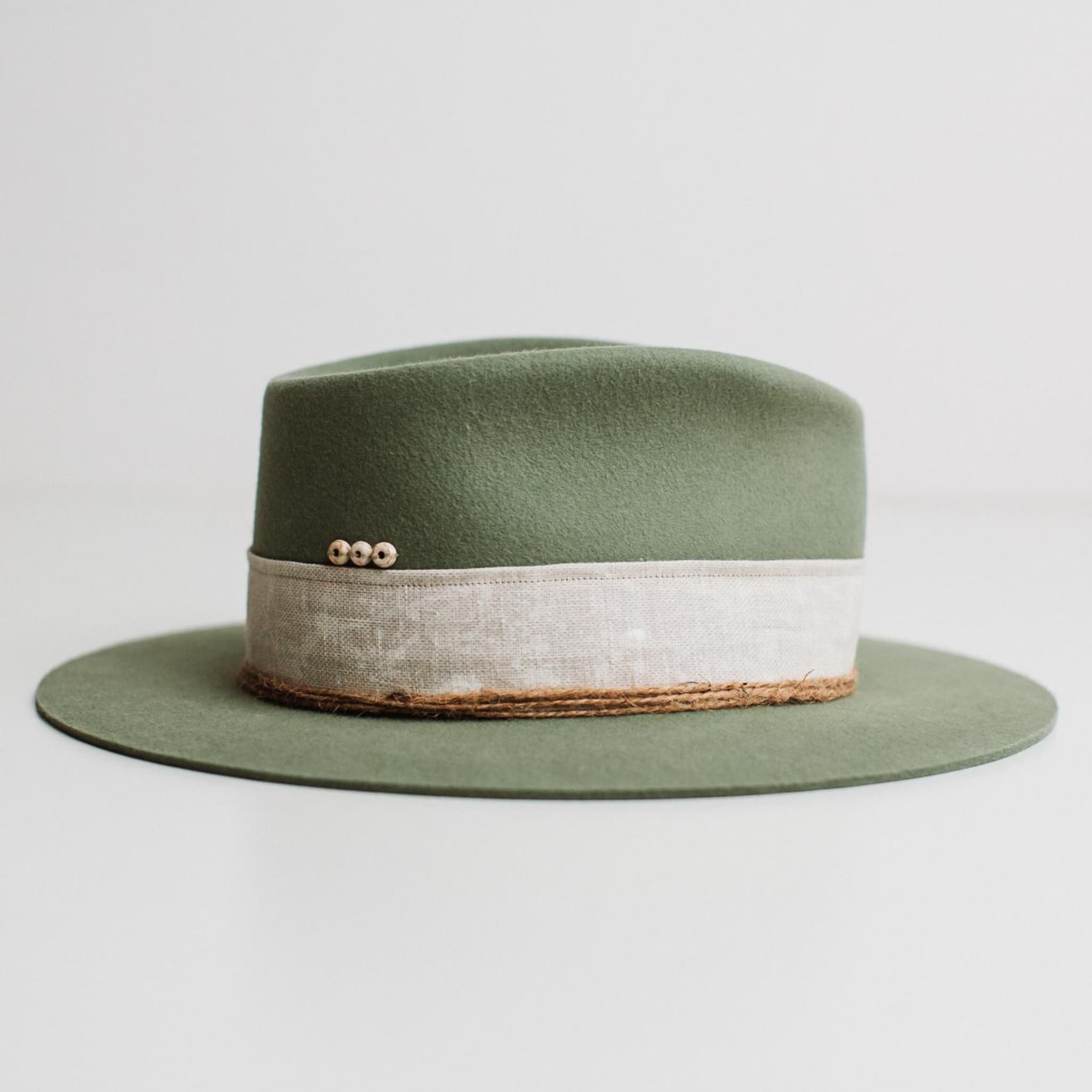 Right side view of The Fall eucalyptus felt hat by PHYLLi Designs with linen band, twine wraps and ivory beading.