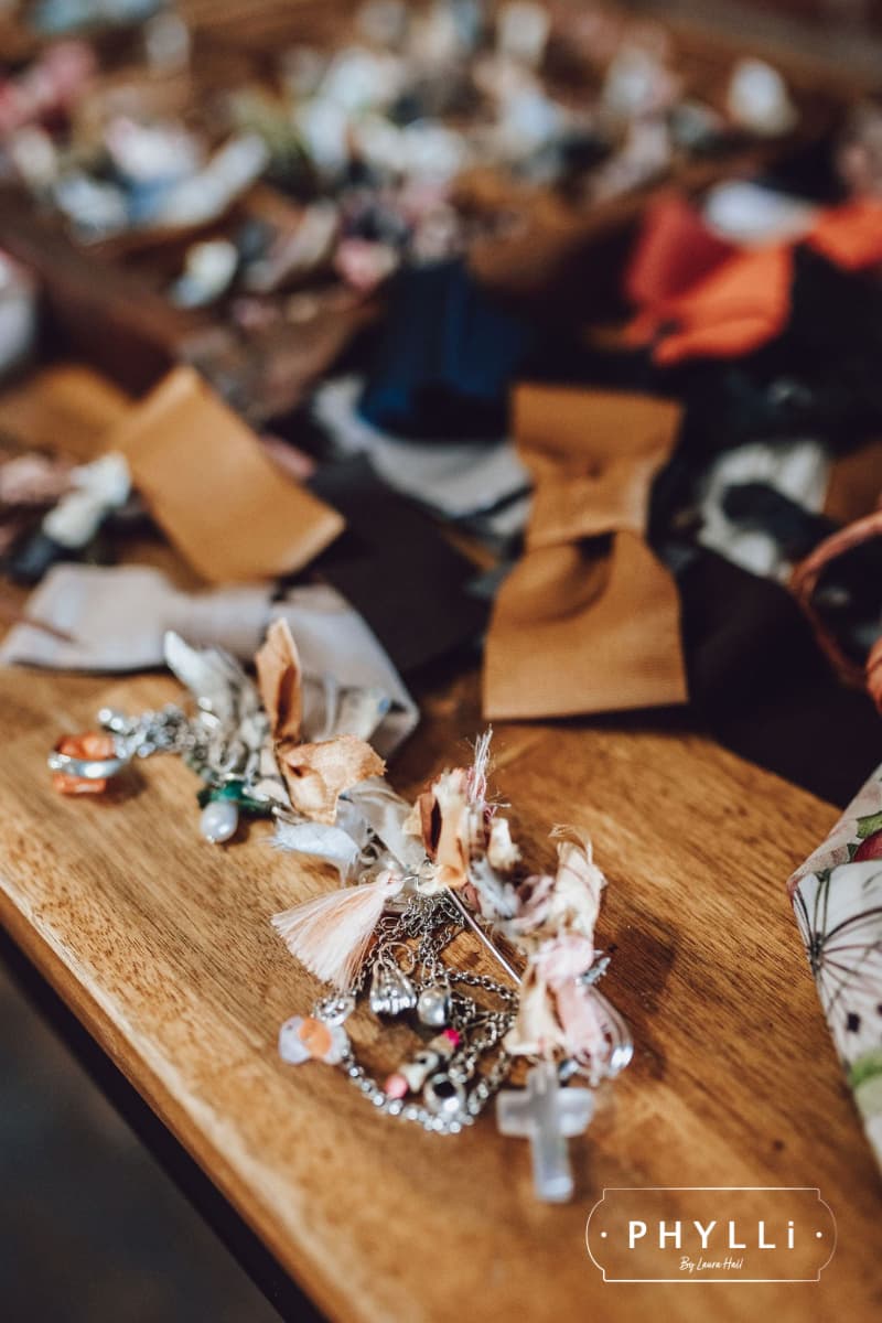 Selection of trims, hat pins and ribbons used to customise hats at a PHYLLi hat bar event.