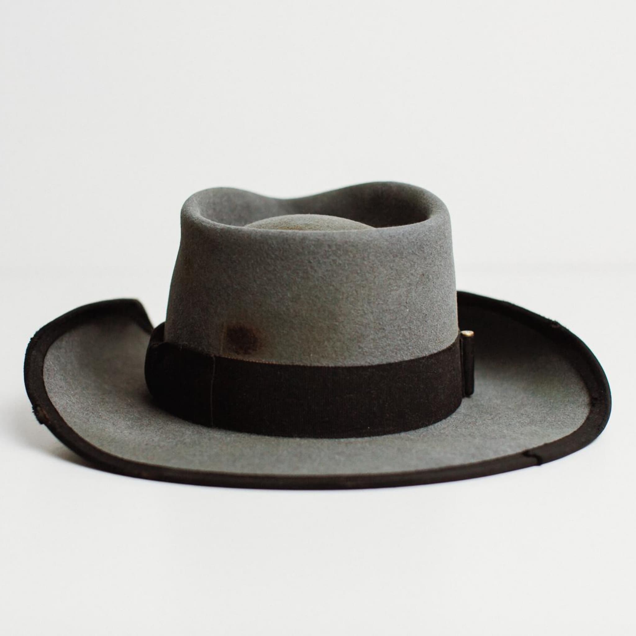 Back view of charcoal felt cowboy hat with curled brim and black grosgrain band by PHYLLi Designs.
